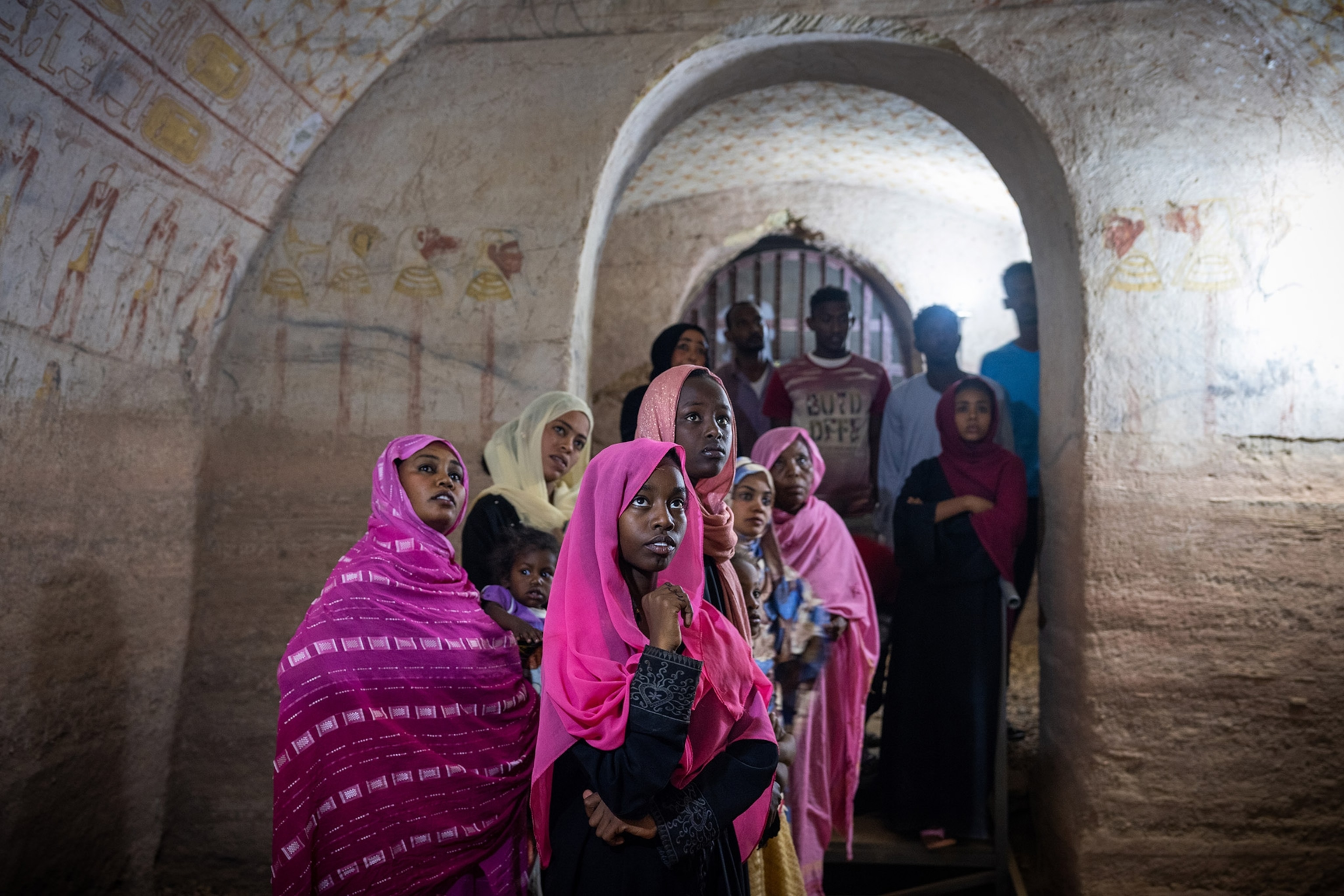 A Sudanese family from nearby Karima, Sudan, tour the ancient site of El Kurru