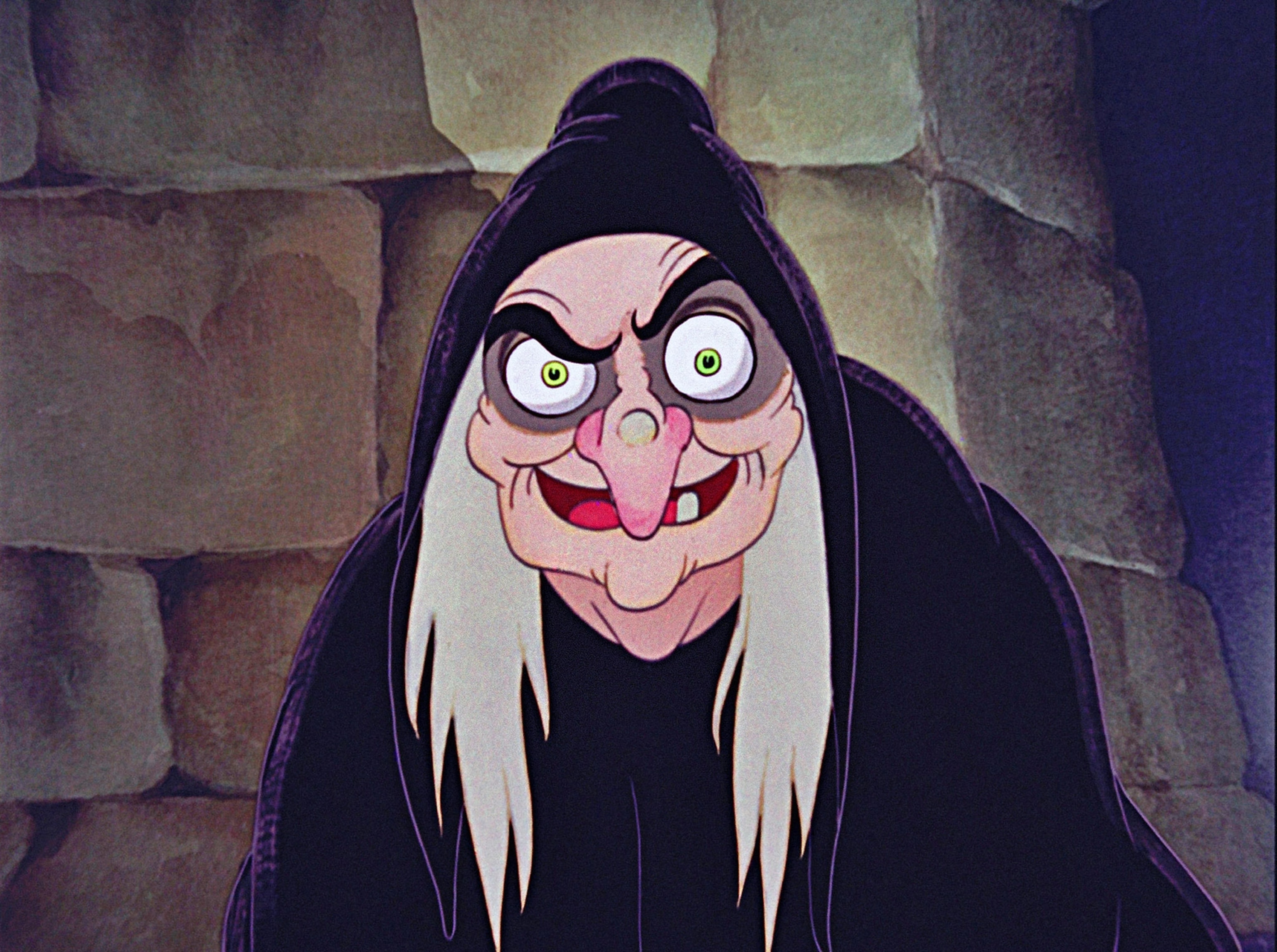 Evil Queen after she's transformed into an old hag with a wart on her crooked nose, green eyes and white hair covered in a dark purple hooded cloak. 