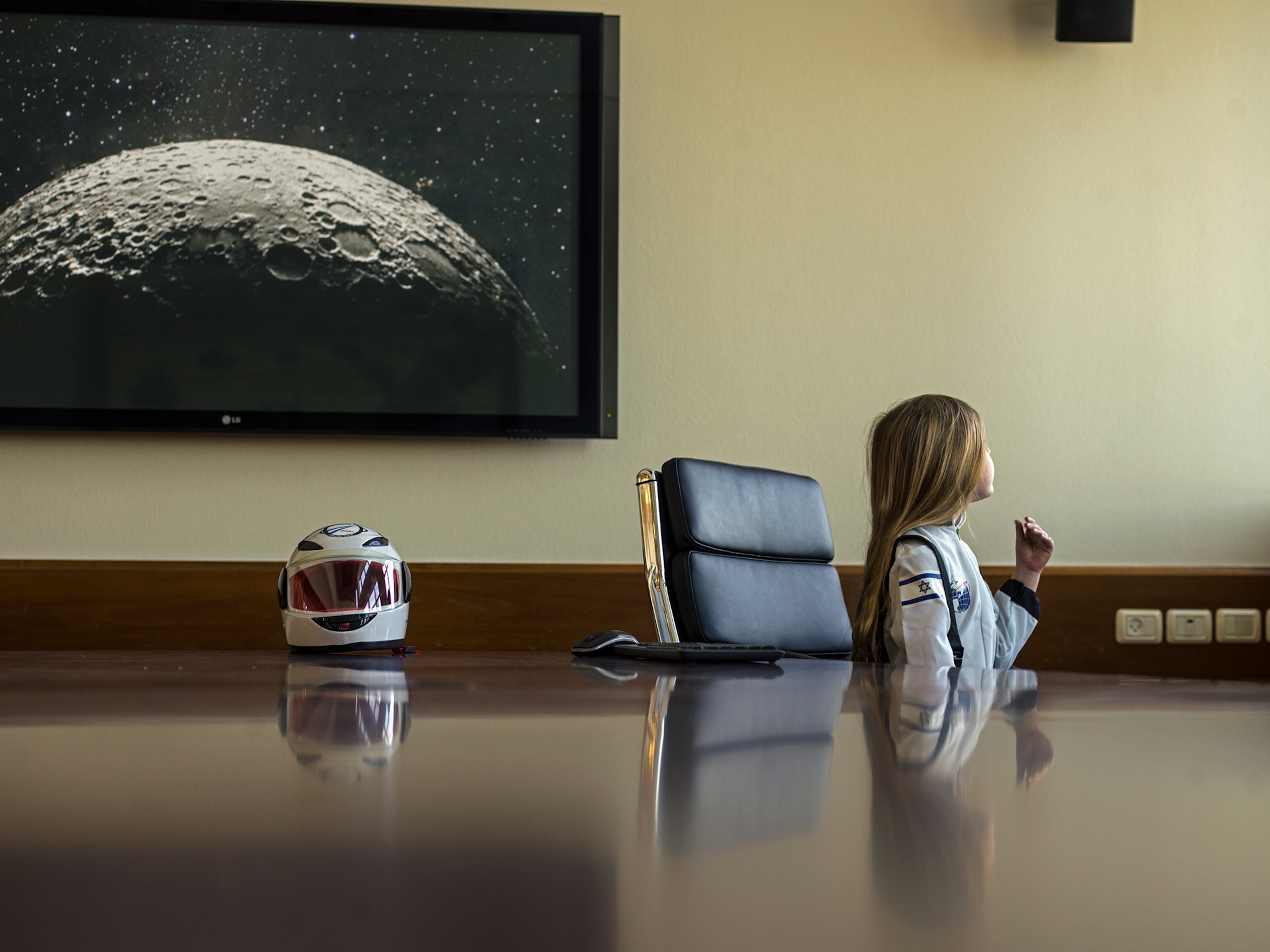 a girl sitting at a desk