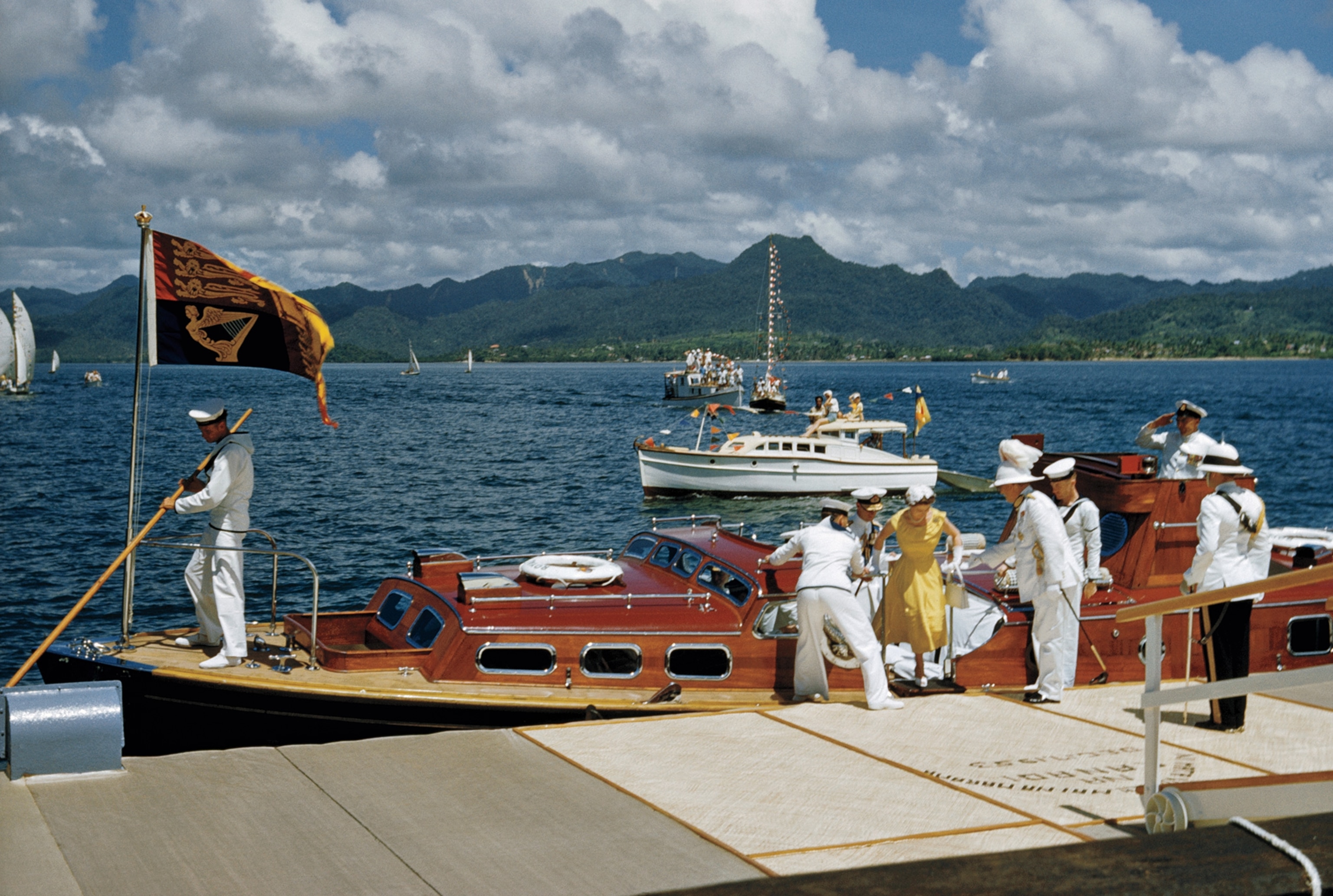 The queen disembarks from a yacht on her visit to Fiji in 1958.