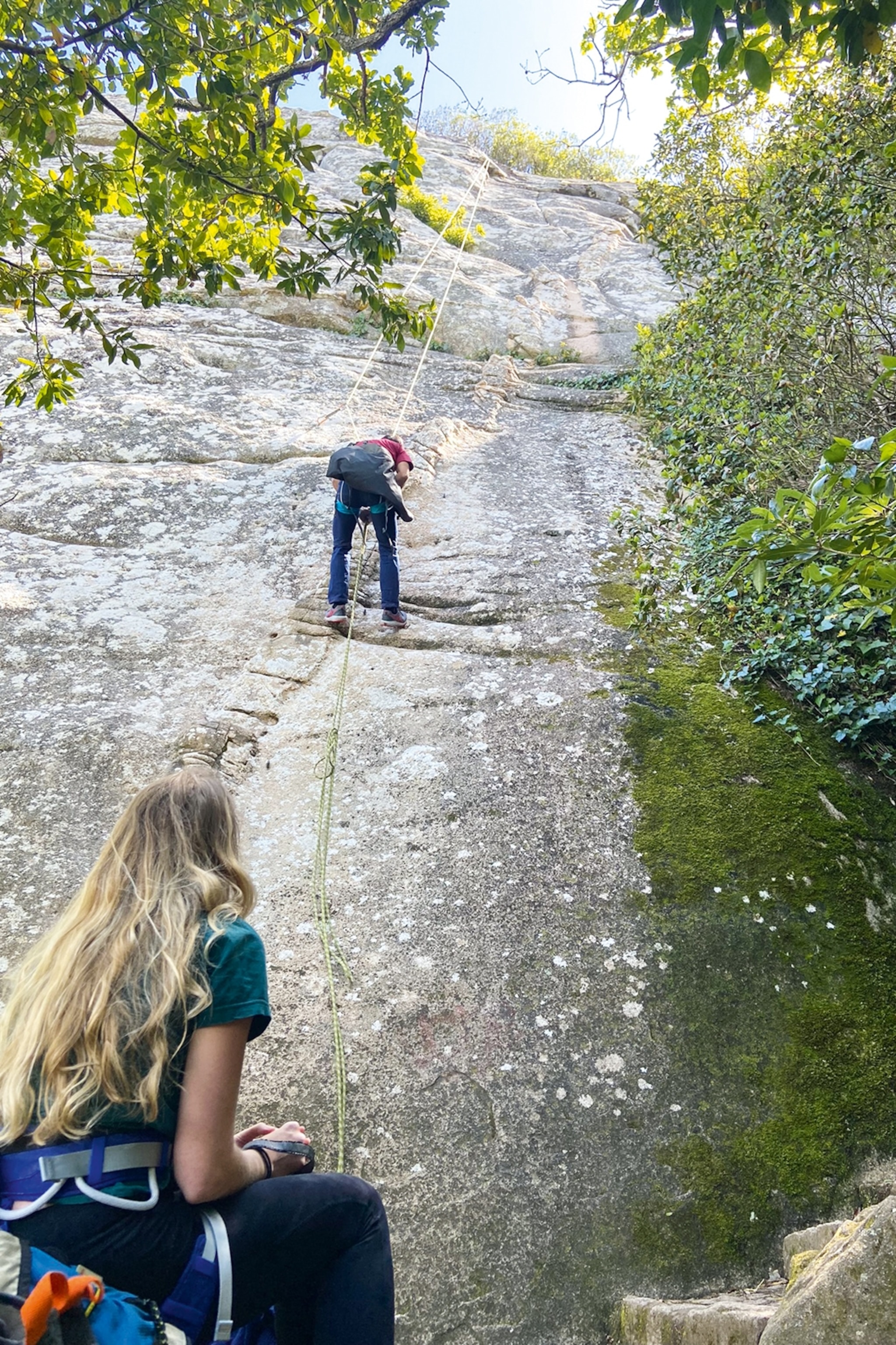 two people rock climbing
