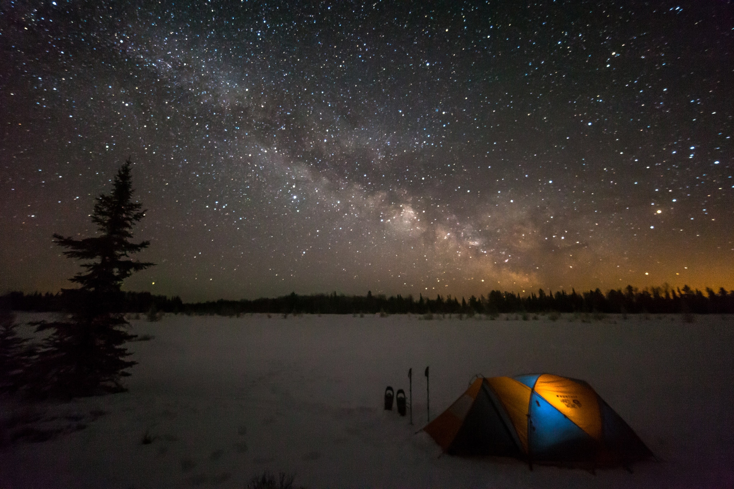 Tent camping under a rising Milky Way in Voyegeur's National Park in Minnesota