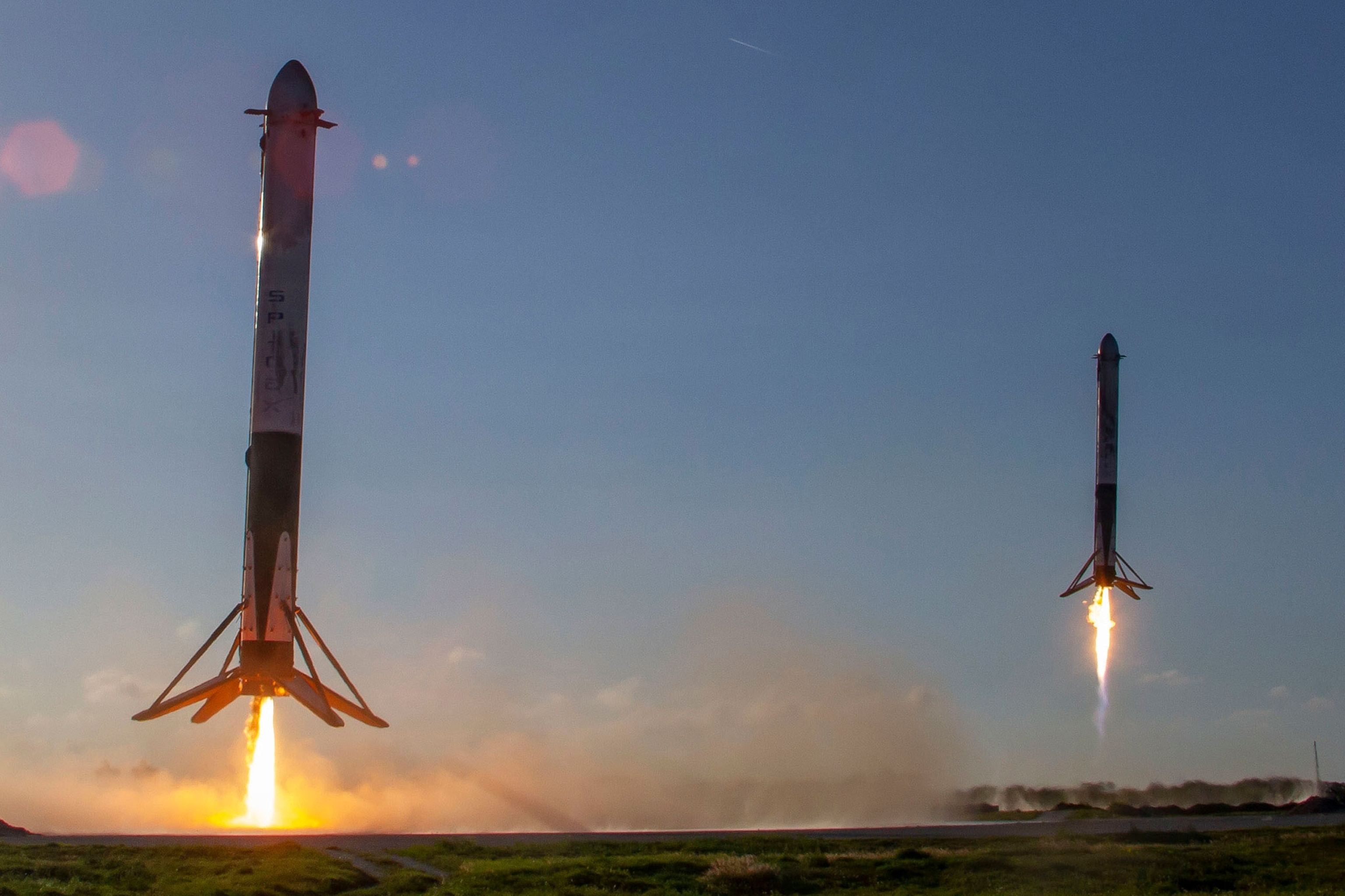 Two booster rockets land successfully.