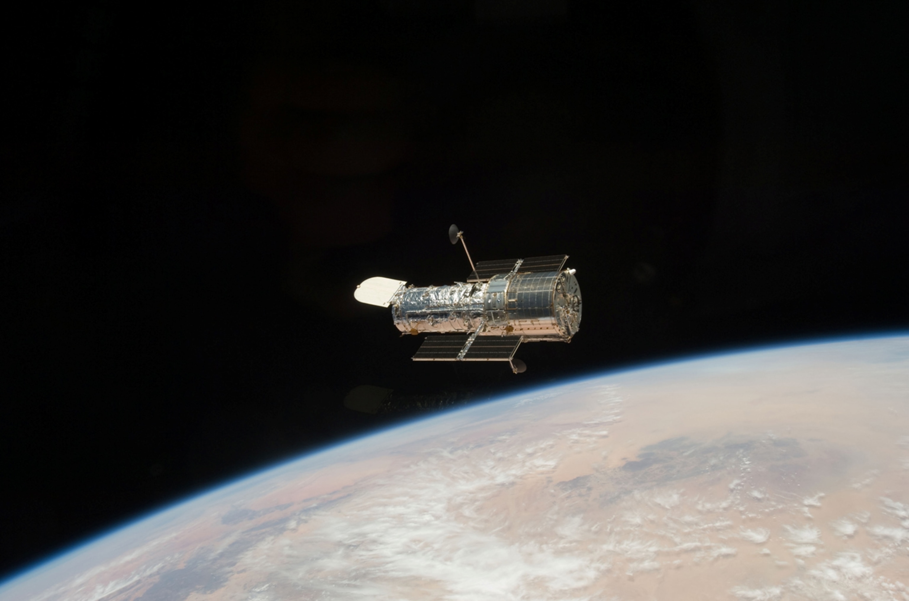 The Hubble Space Telescope studies the dynamics of celestial entities, the nature of processes which occur in the extreme physical conditions in and between astronomical objects, the history and evolution of the universe, and whether the laws of nature are universal in the space-time continuum without the distortion of the atmosphere that limits terrestrial telescopes.