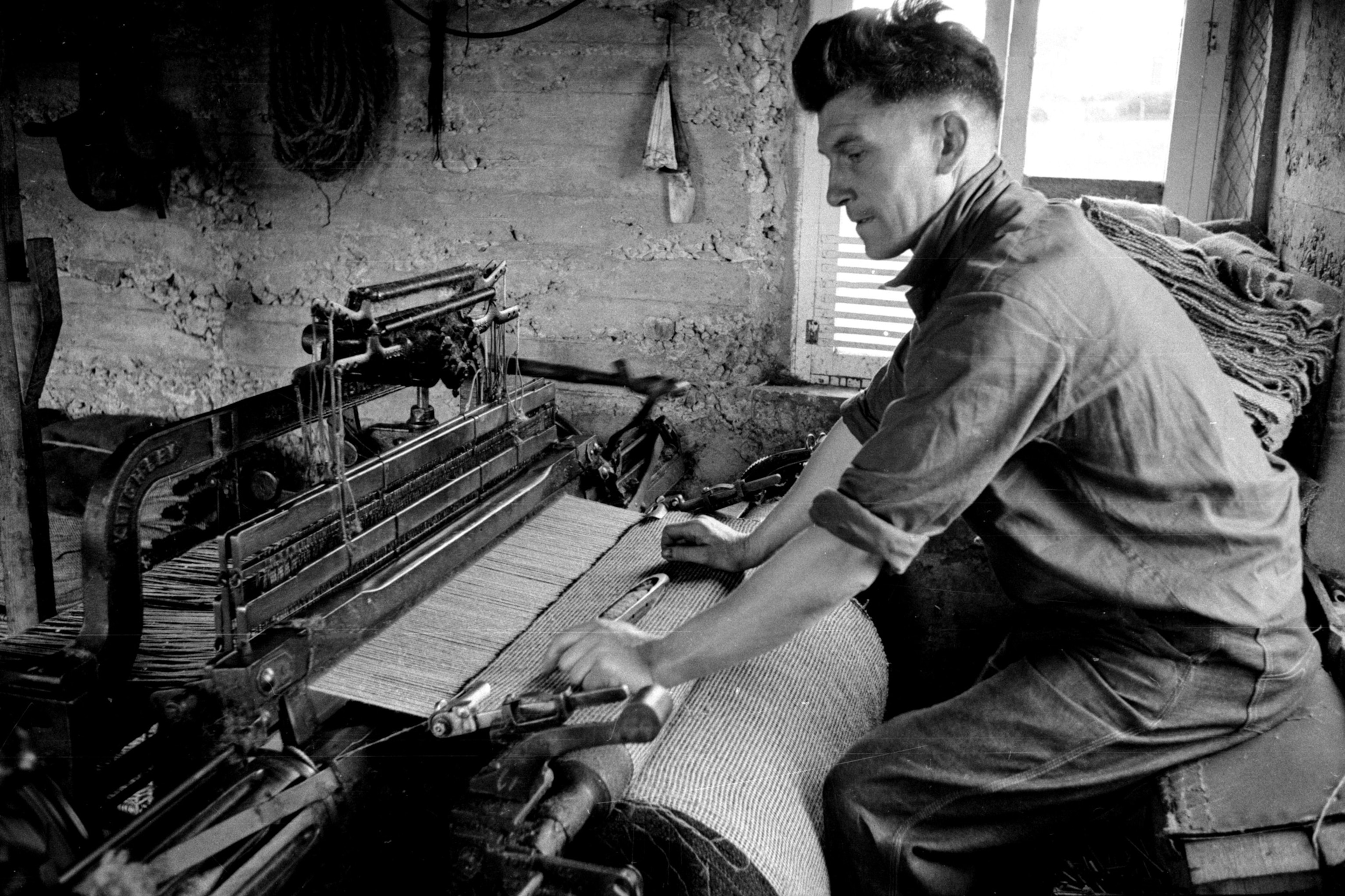 A crofter on the island of Lewis and Harris in the Outer Hebrides weaving Harris tweed