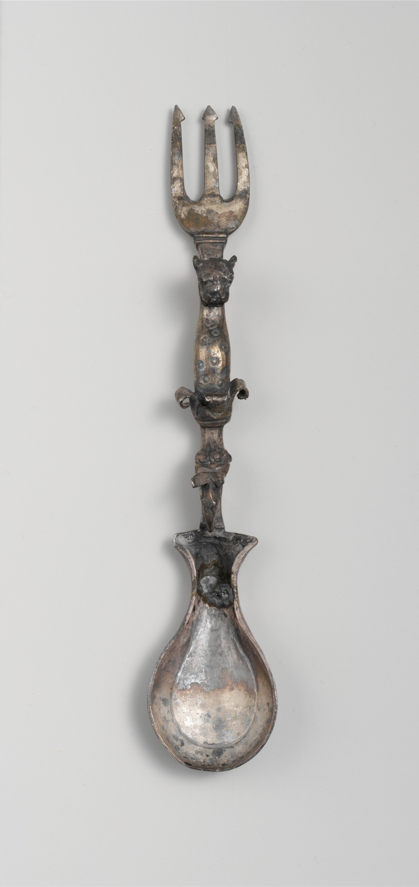 A fork and spook together on a white grey background.