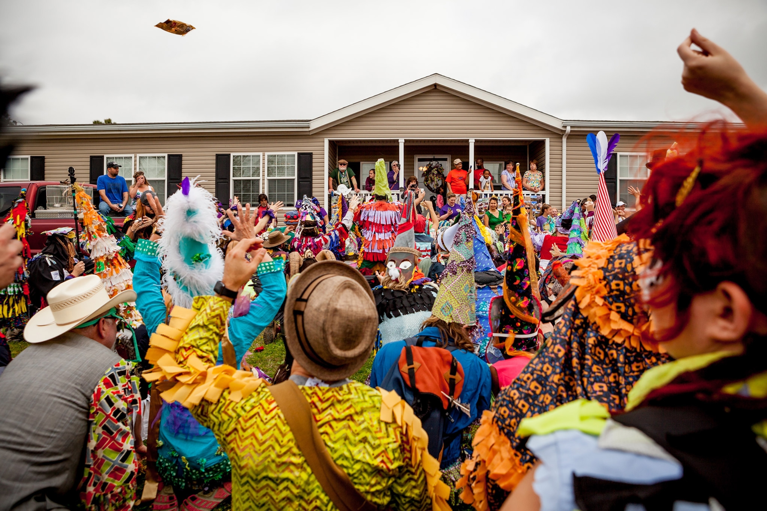 people begging at a house on the Courir de Mardi Gras celebration in Eunice, Louisiana