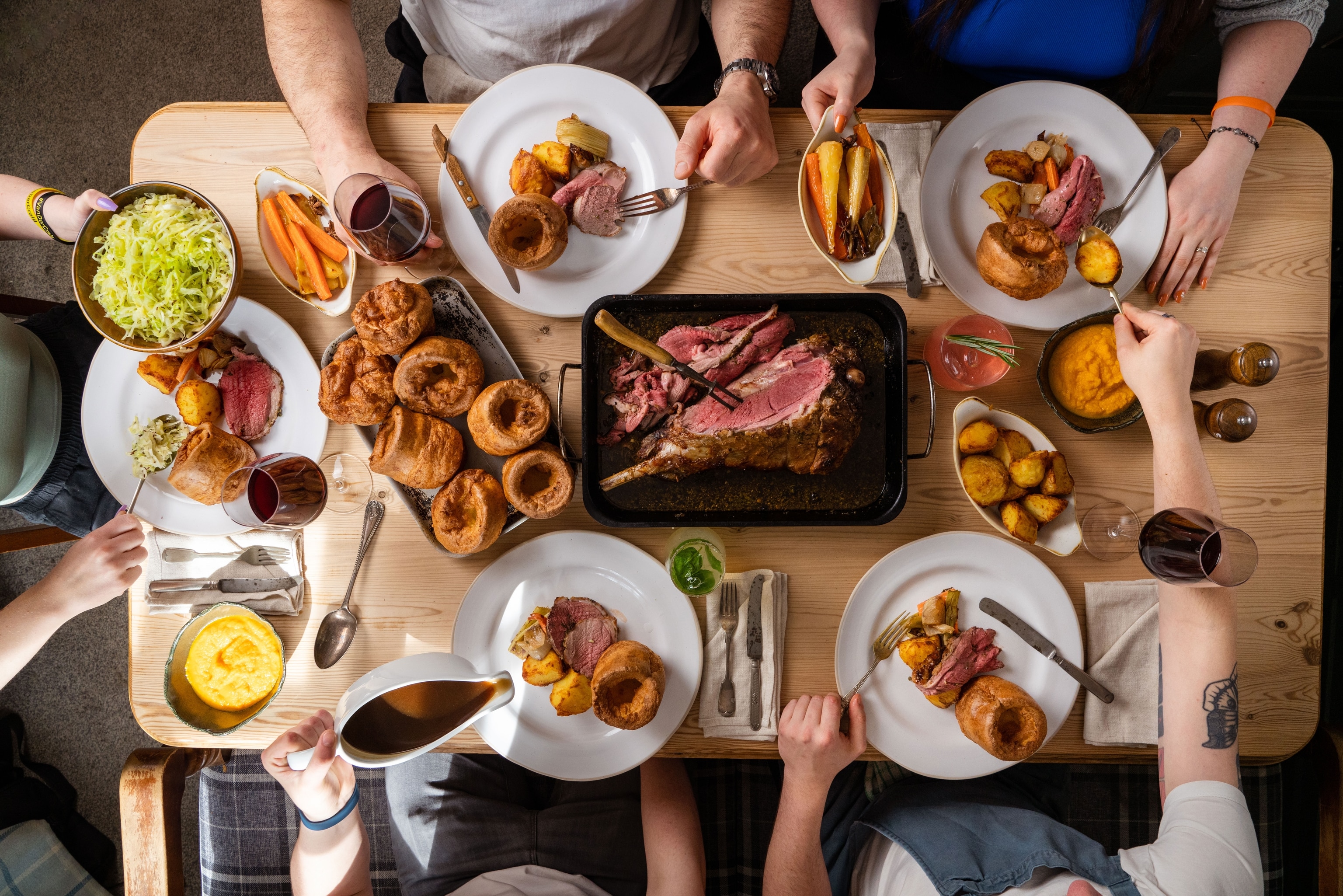 several people sharing a meal, picture shot from overhead