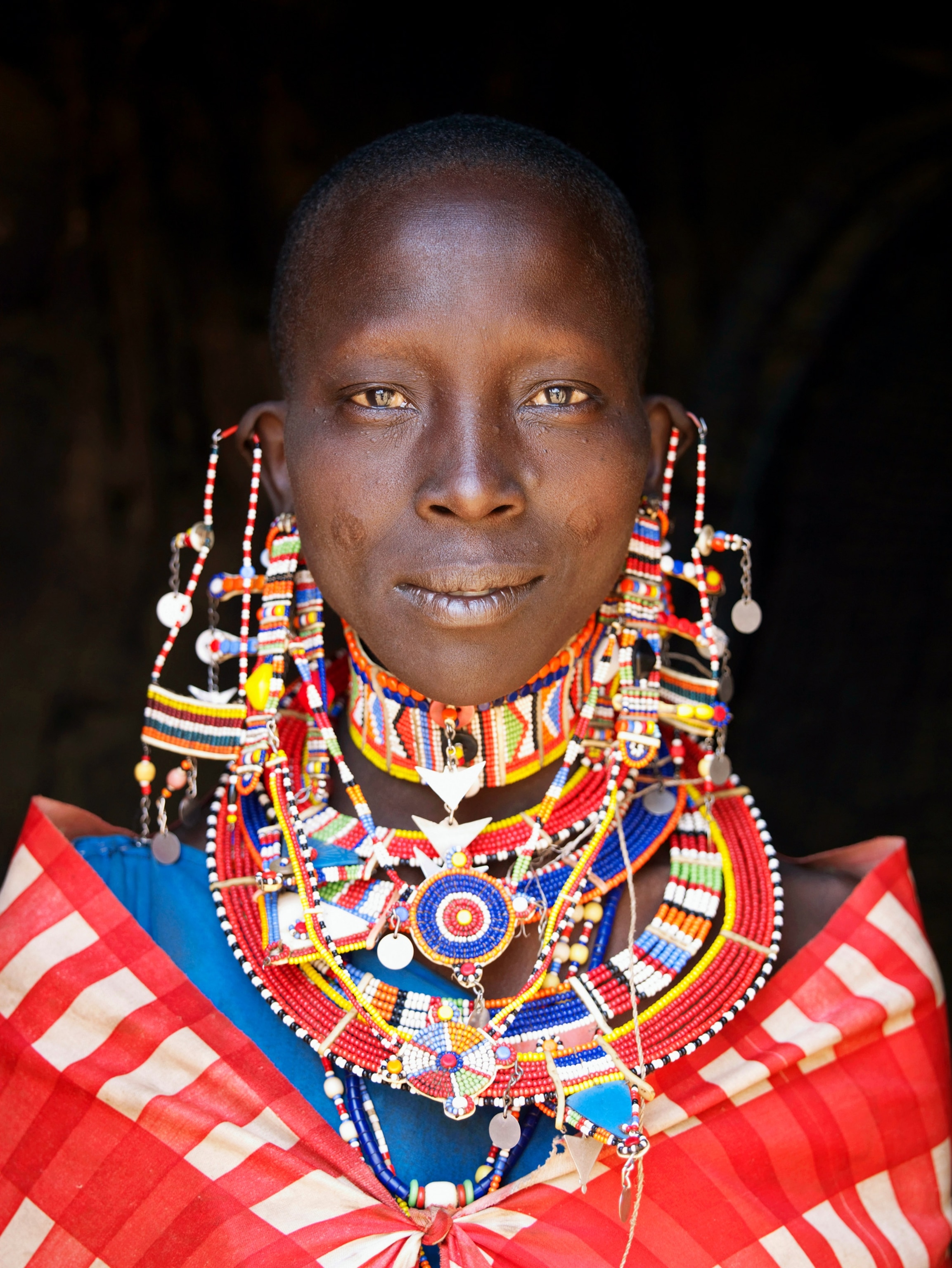 a Maasai women wearing a beaded necklace, Kenya