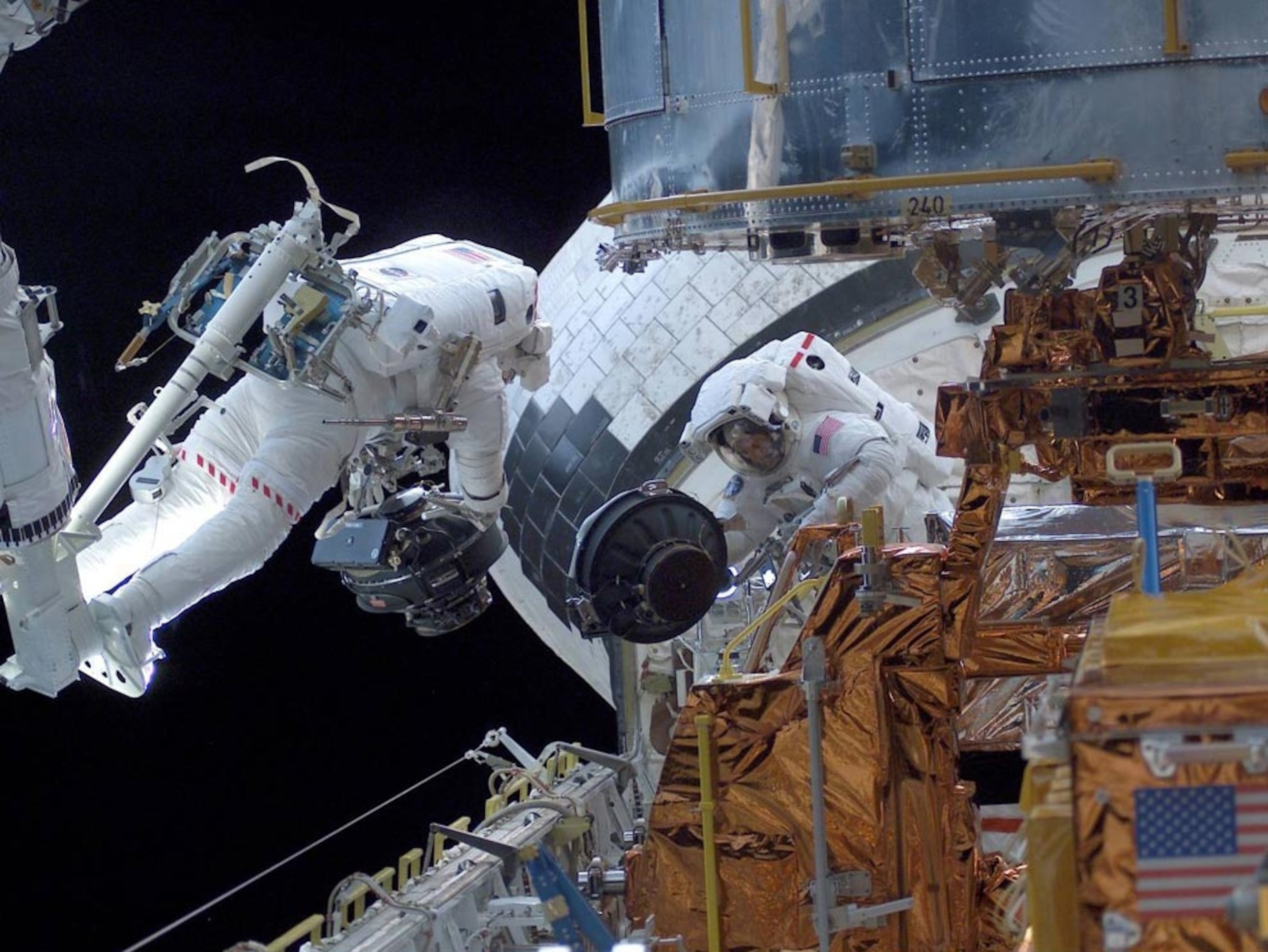 astronauts upgrading Hubble Space Telescope