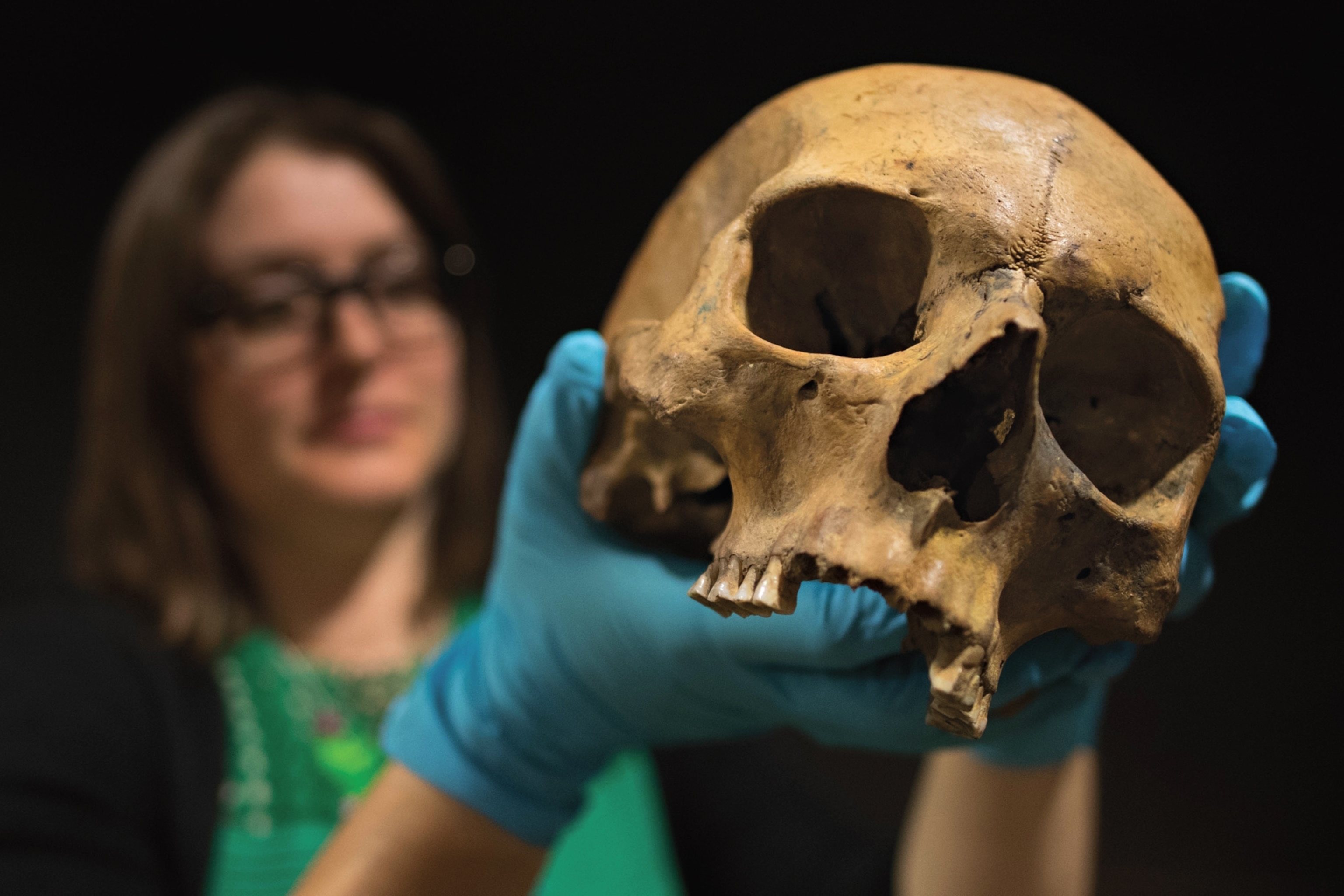 Photo of woman holding skull