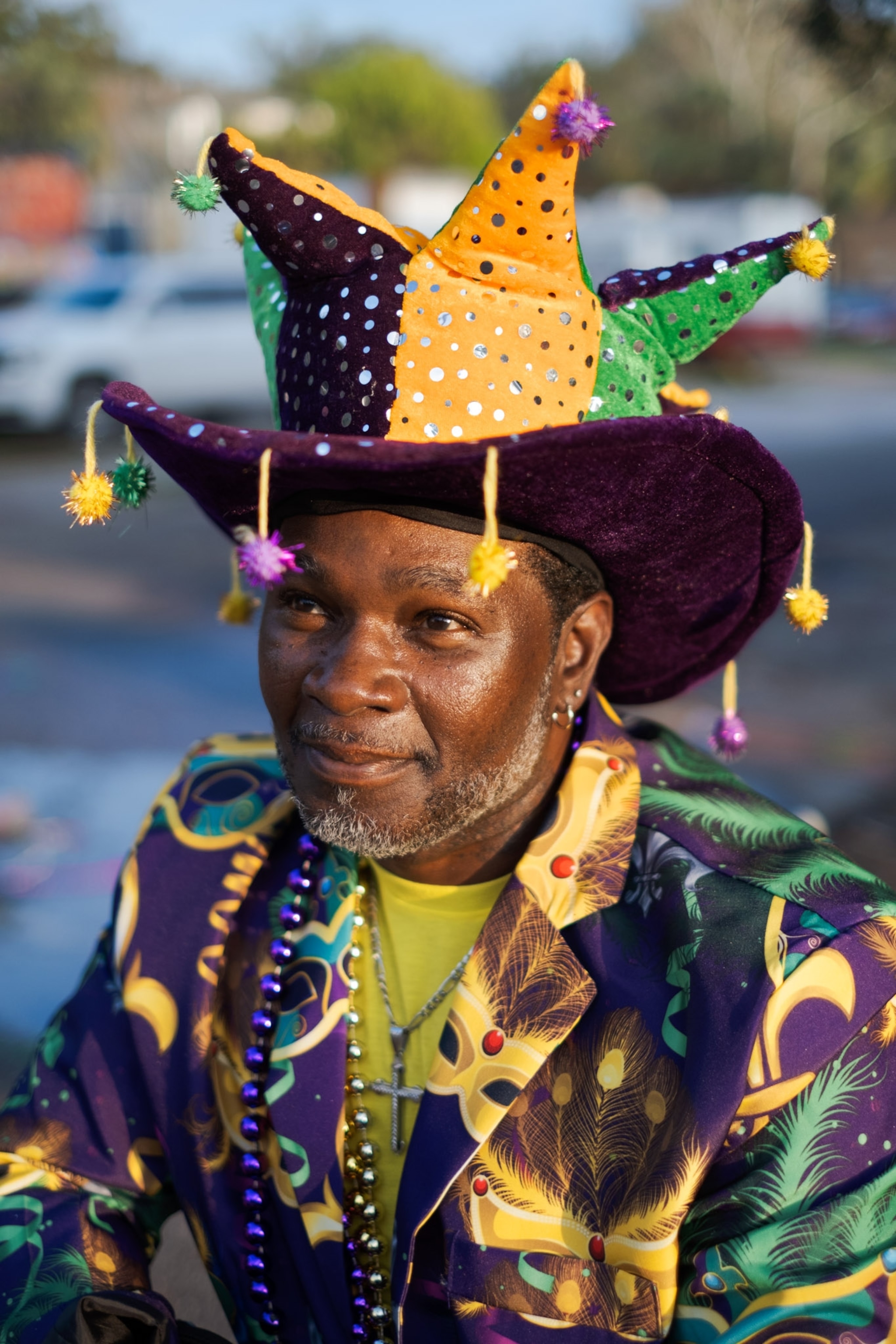 a man wearing a sequined top hat to celebrate Mardi Gras