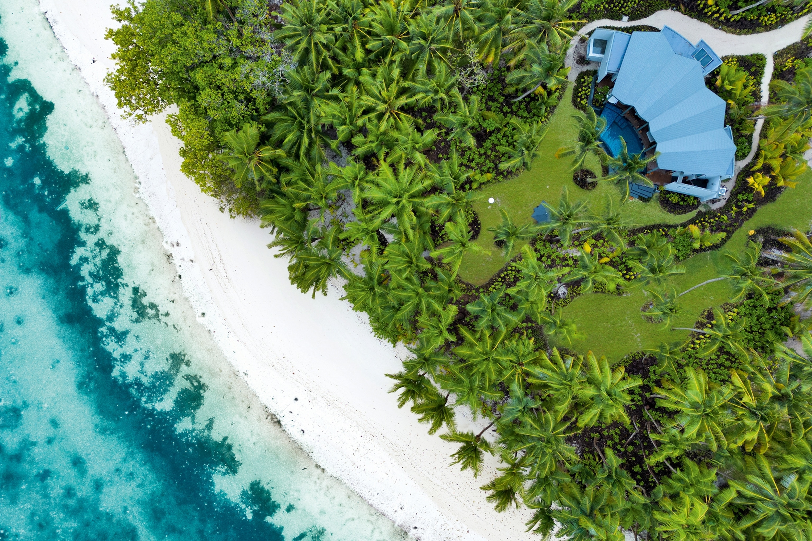 aerial view of a villa on a beach