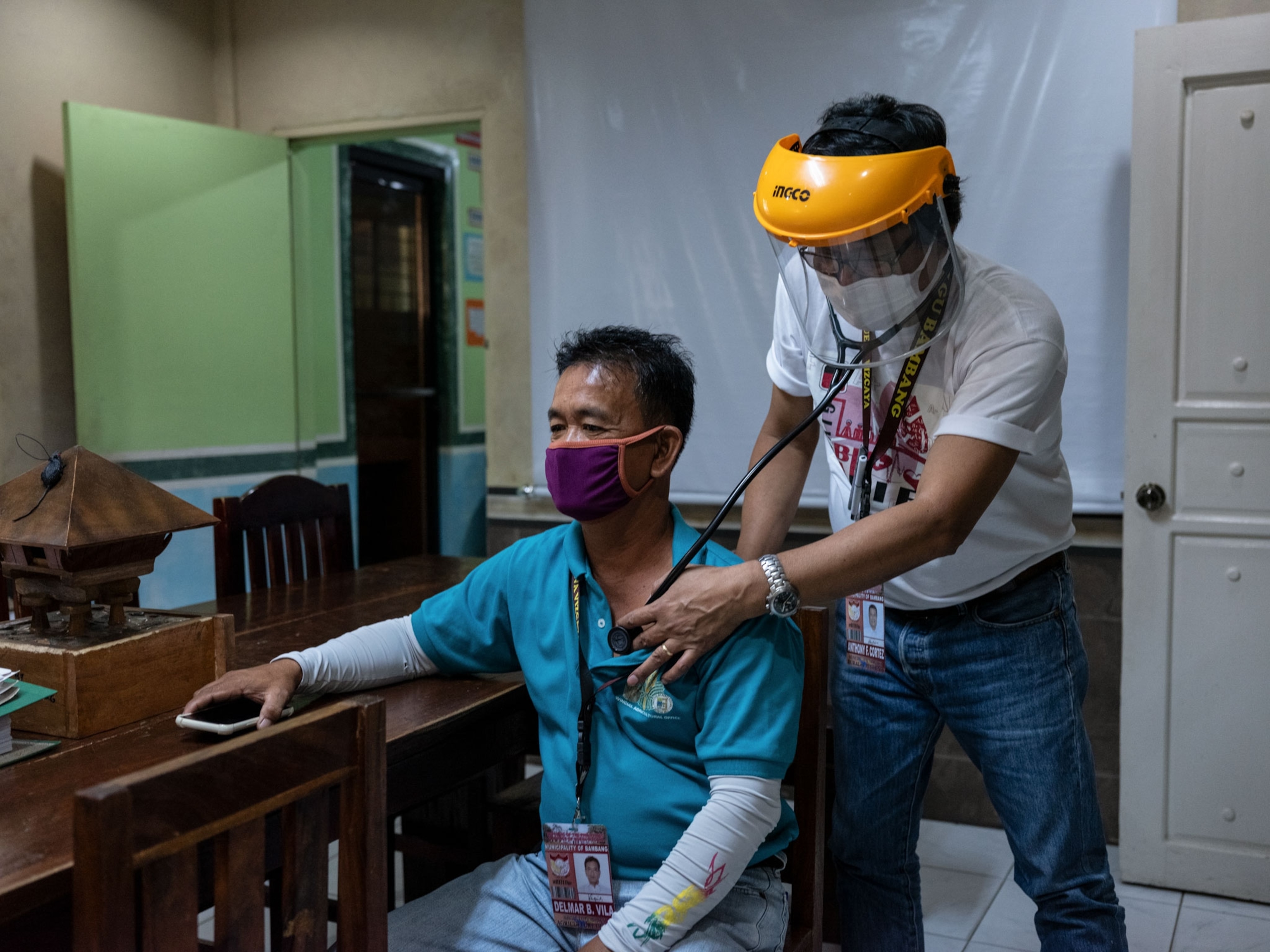 a doctor examining a patient in the Philippines