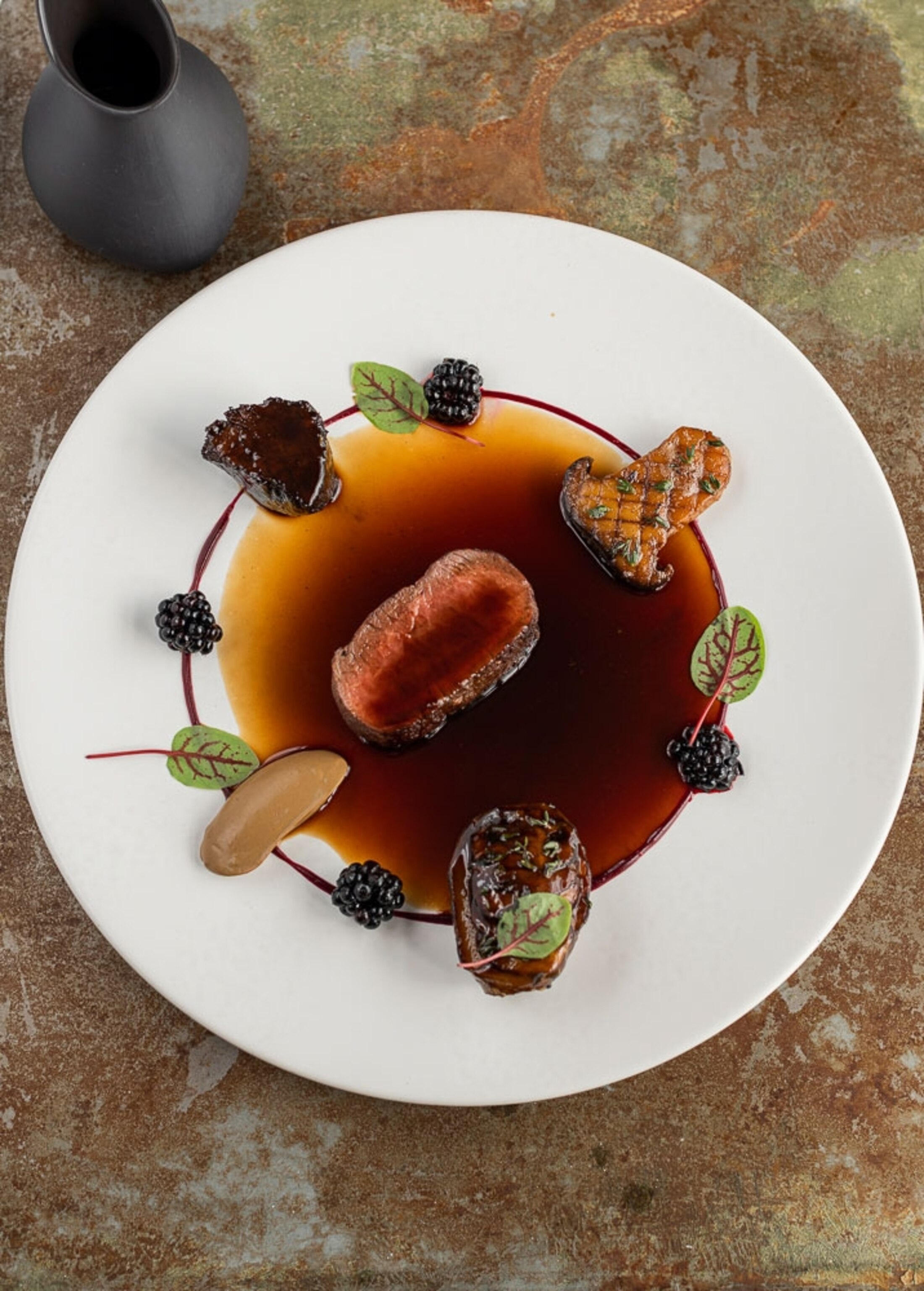 image of dish including venison, mushrooms and berries