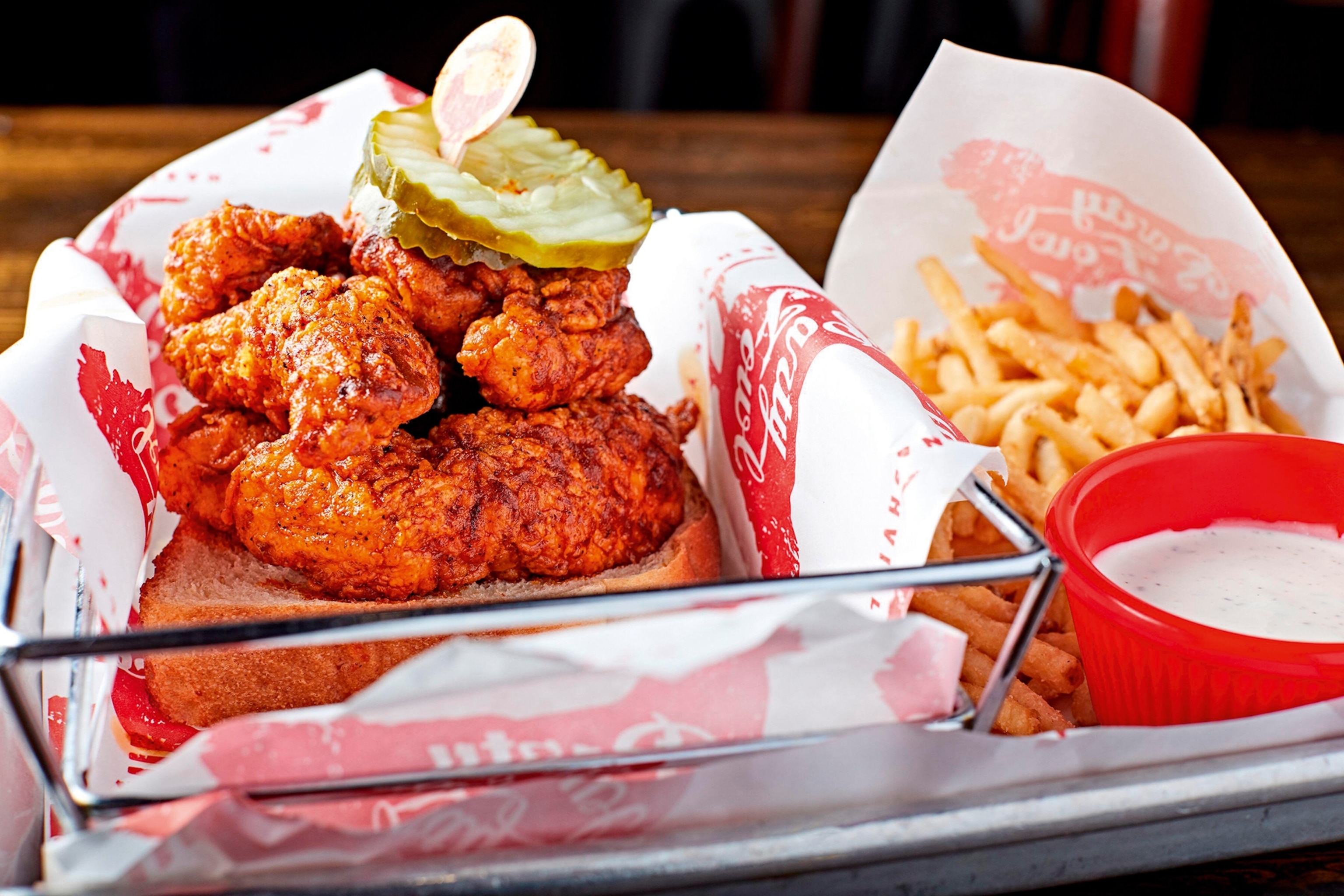 A plate of Nashville hot chicken and chips.