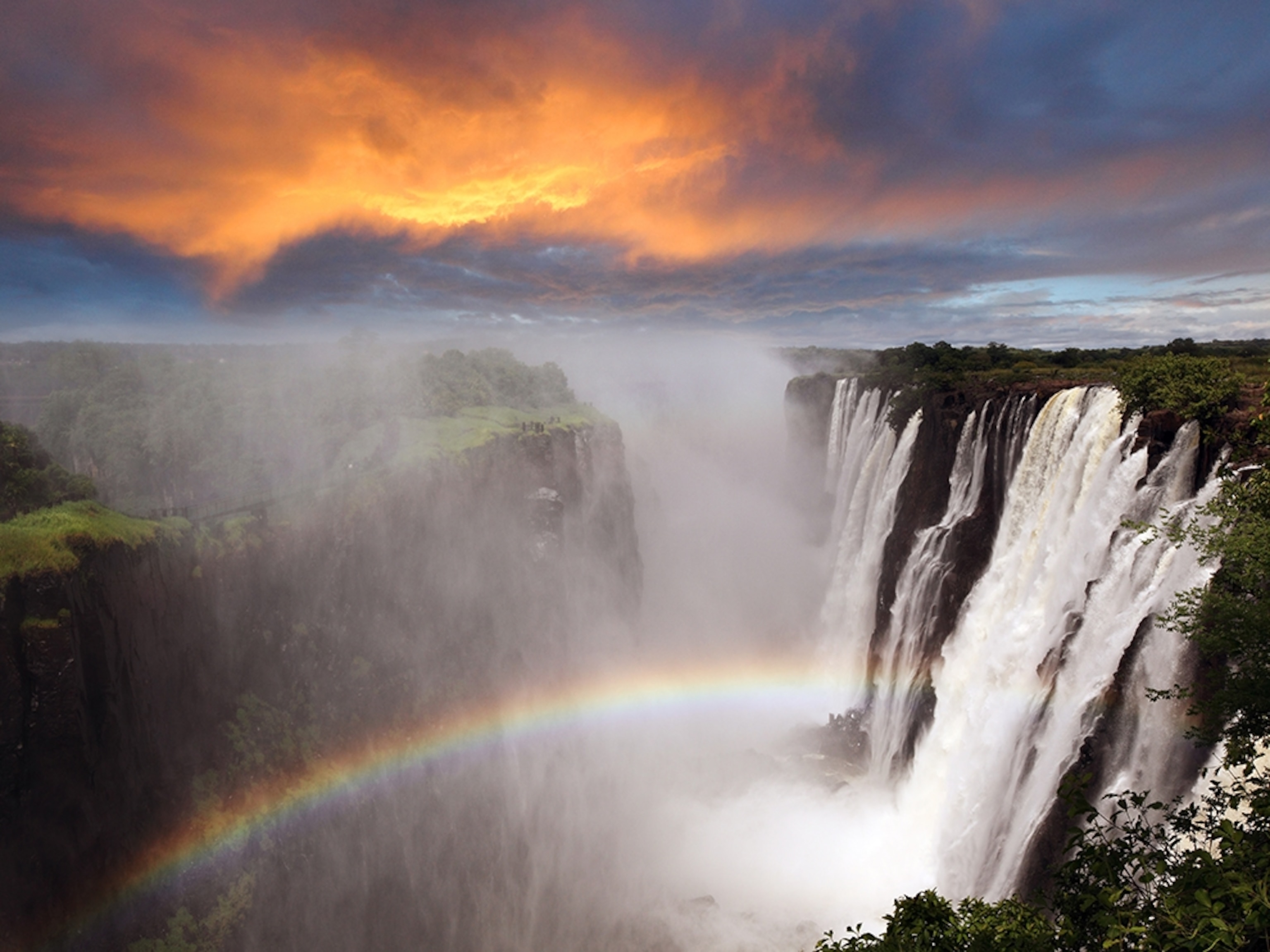 a rainbow in the mists of Victoria Falls