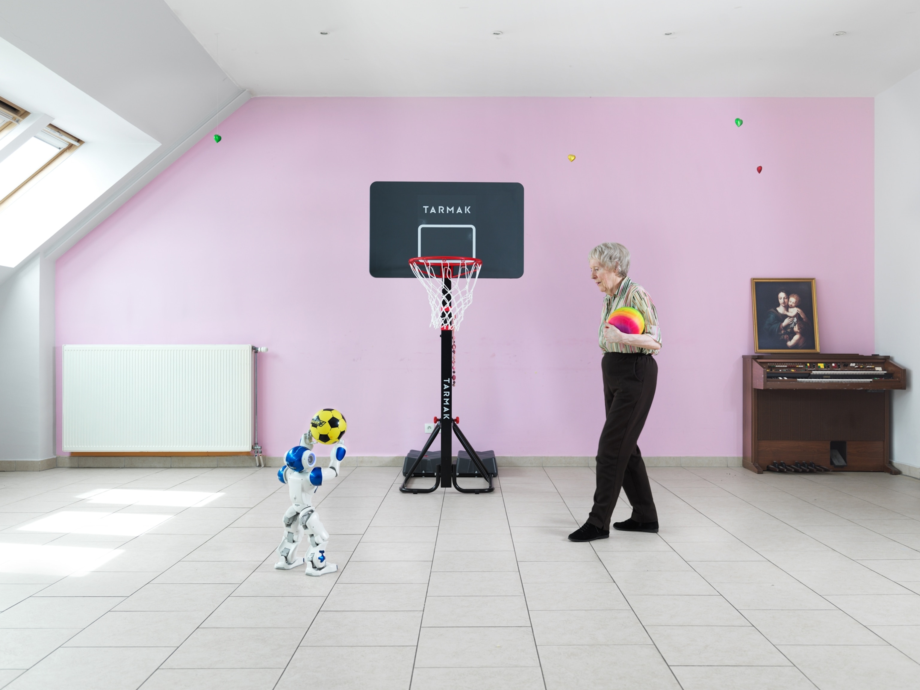 robot playing basketball withe woman
