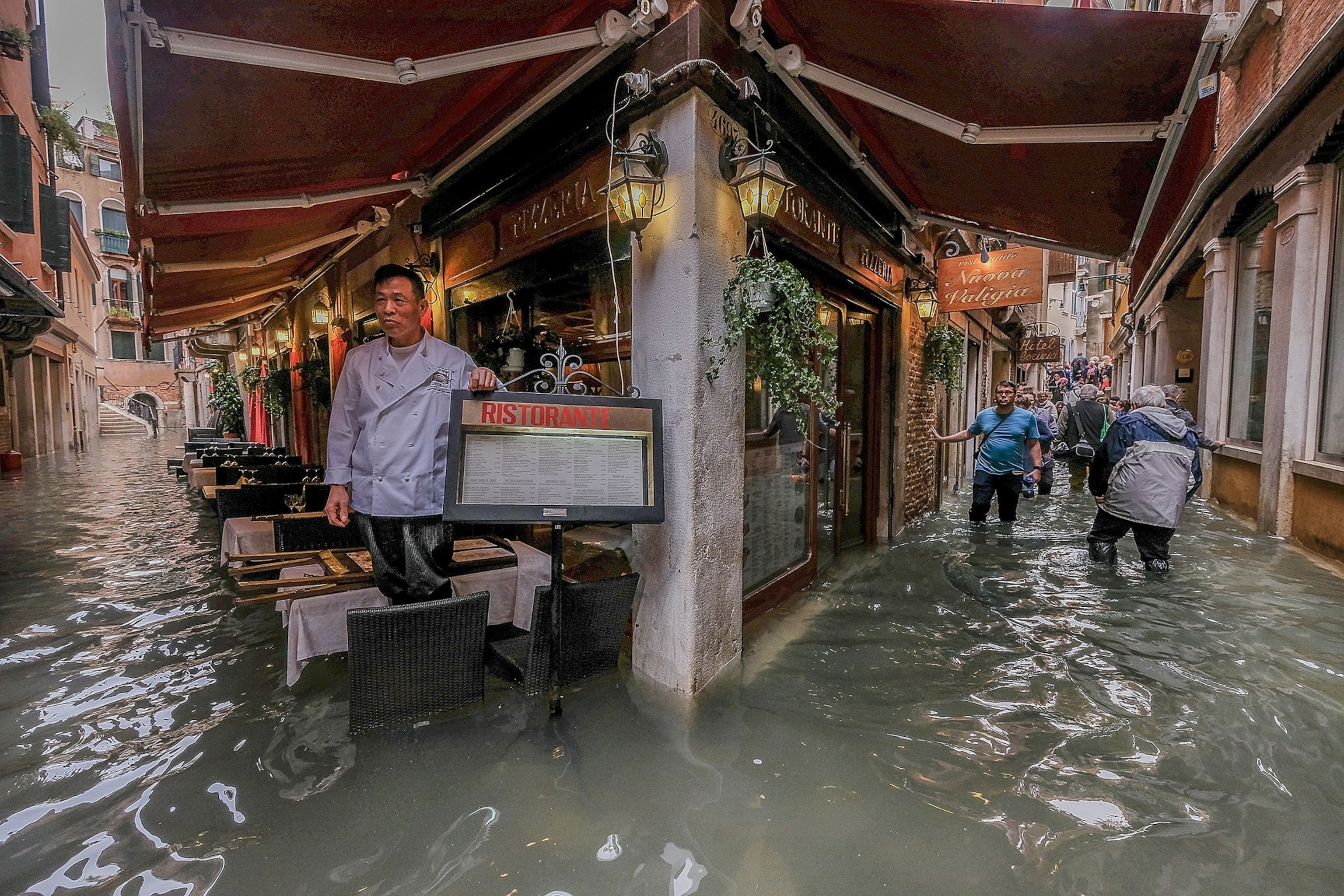 a flooded sidewalk cafe