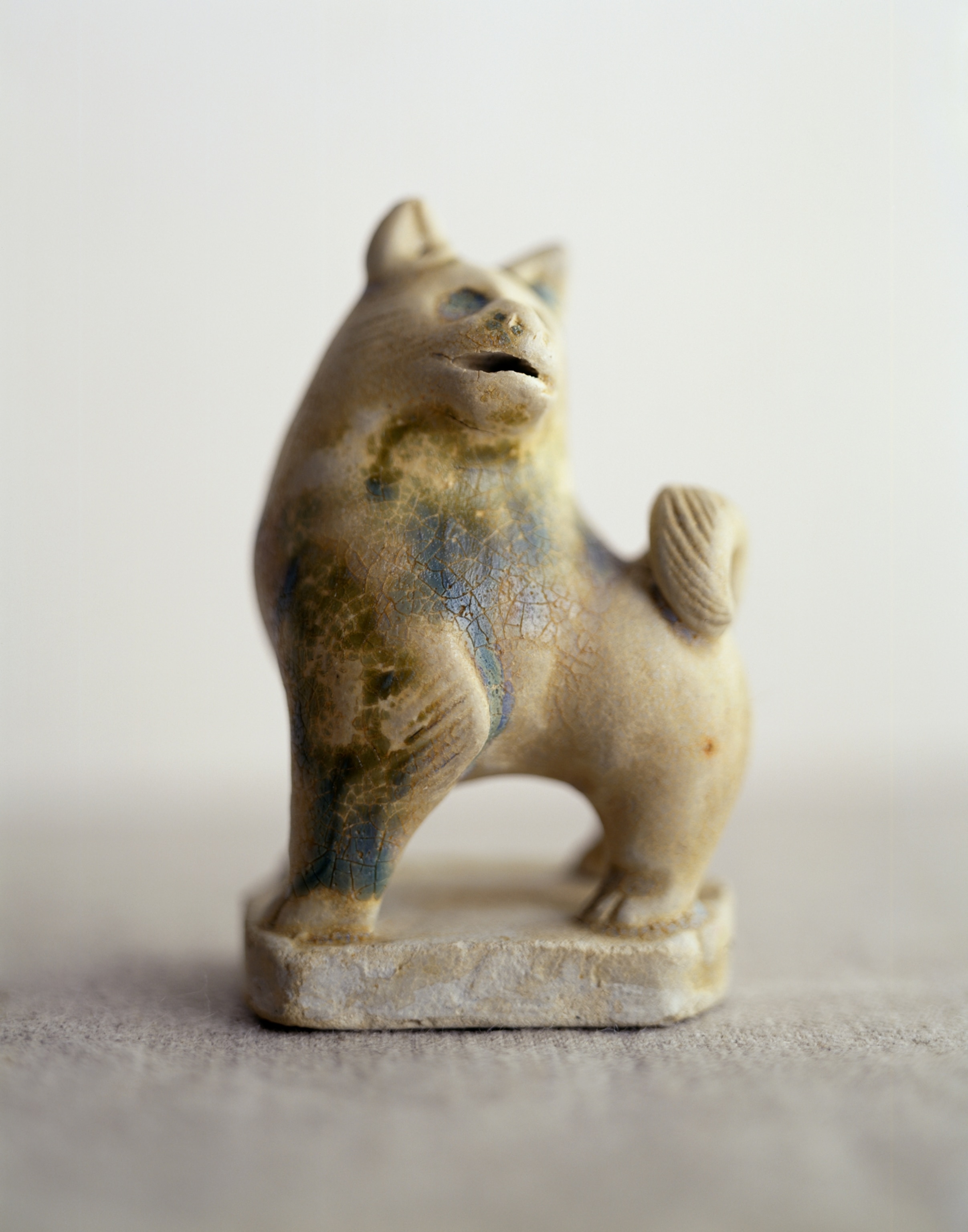 a three-inch-tall decorative figurine of a dog from the Belitung wreck