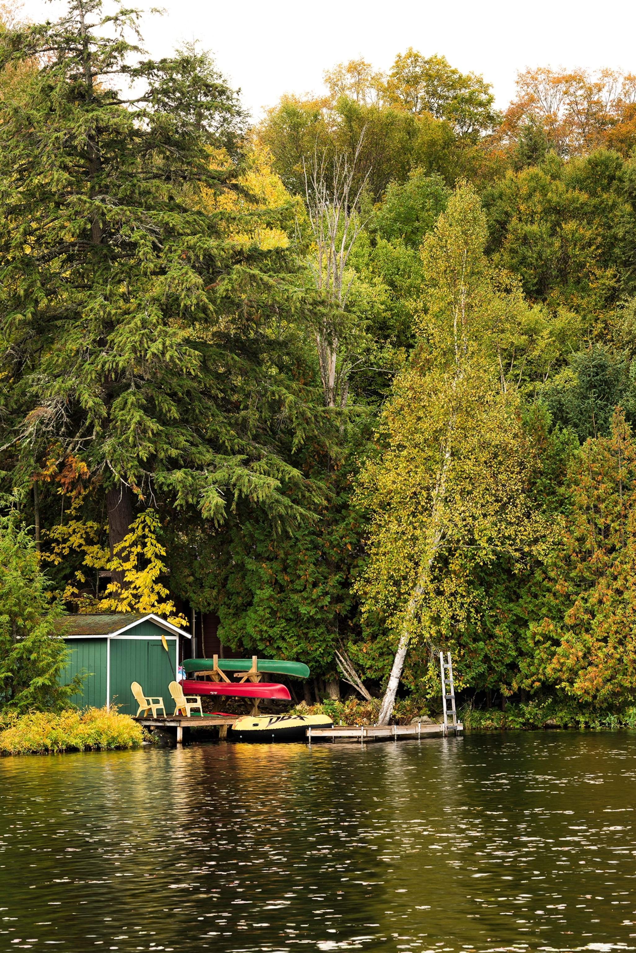 Boathouse on Lake Colby with autumn foliage, Saranac Lake, Essex County, New York
