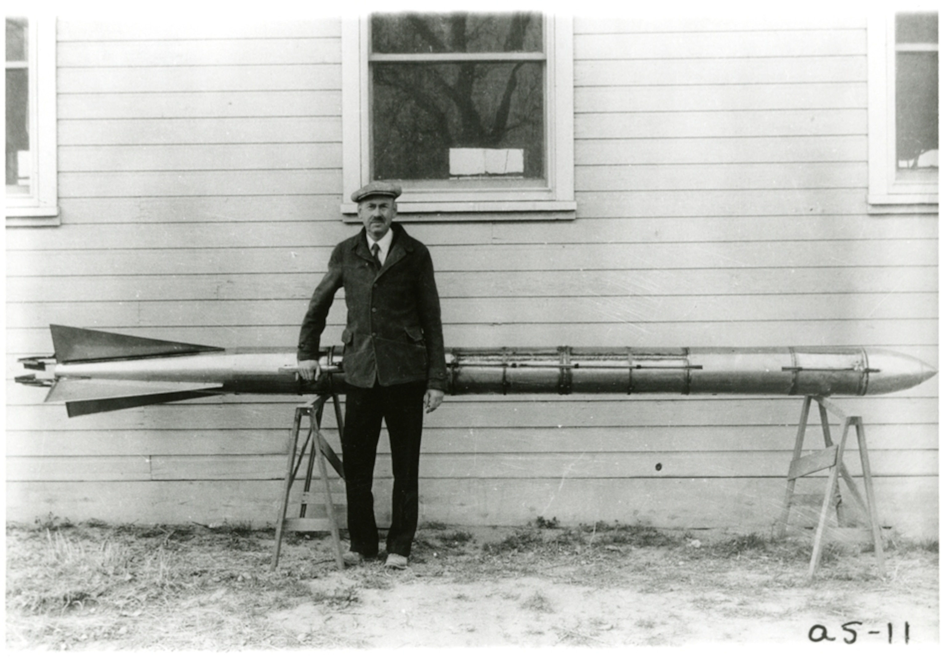 a man in front of a rocket in New Mexico.