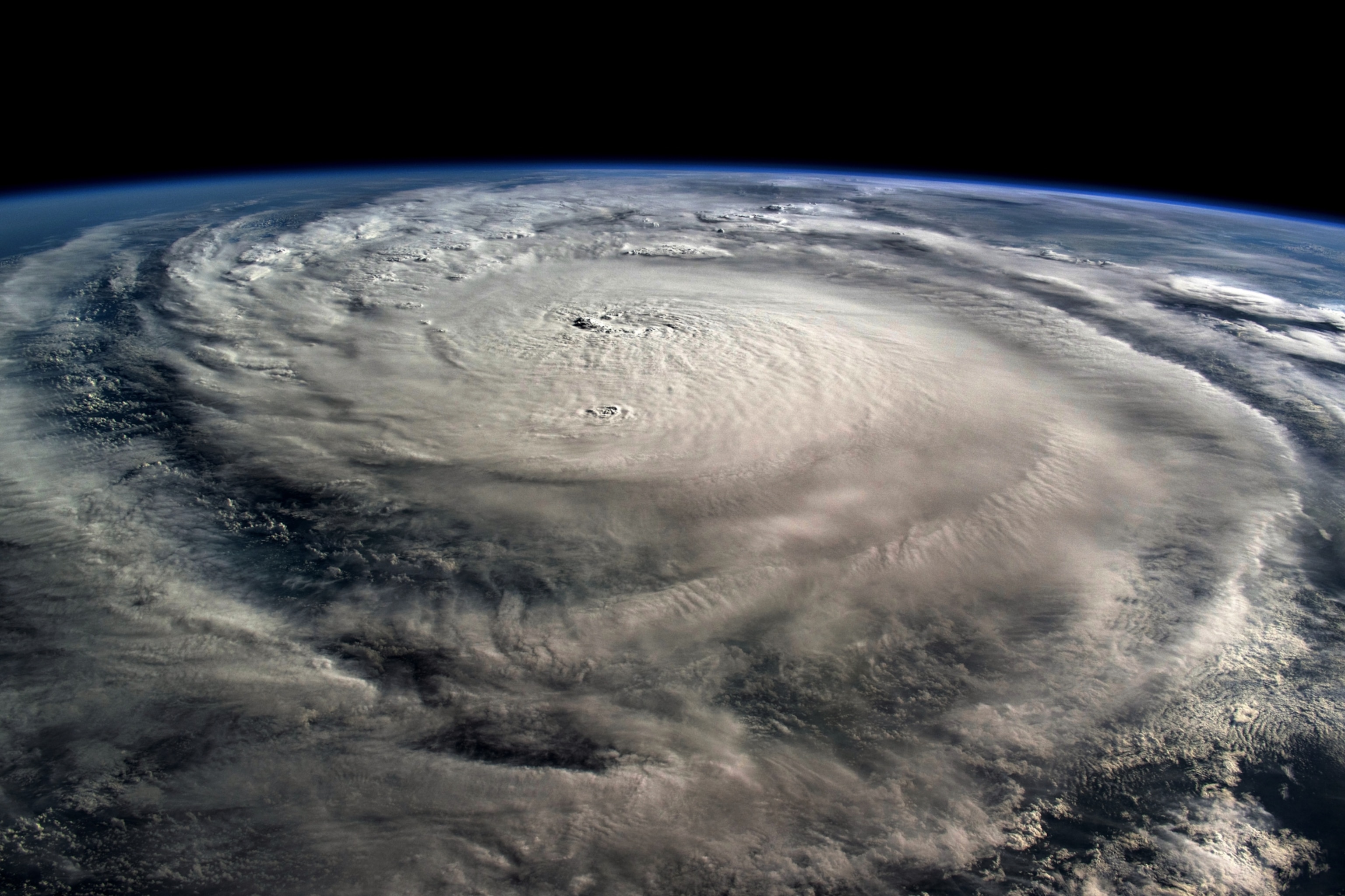 A view of an enormous swirl of clouds forming Hurricane Milton, as seen looking down from the International Space Station.