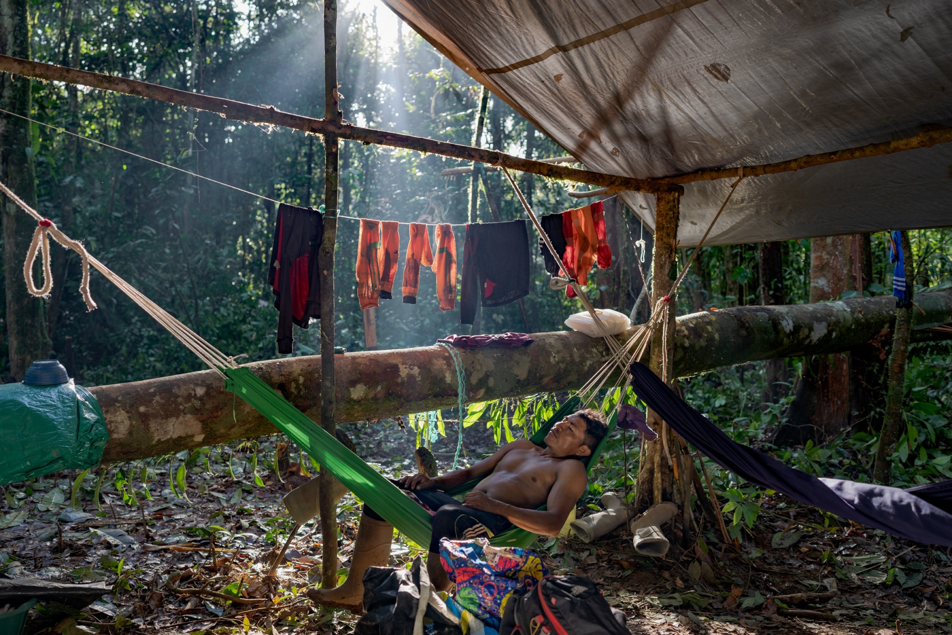 Picture of man resting in hammock.