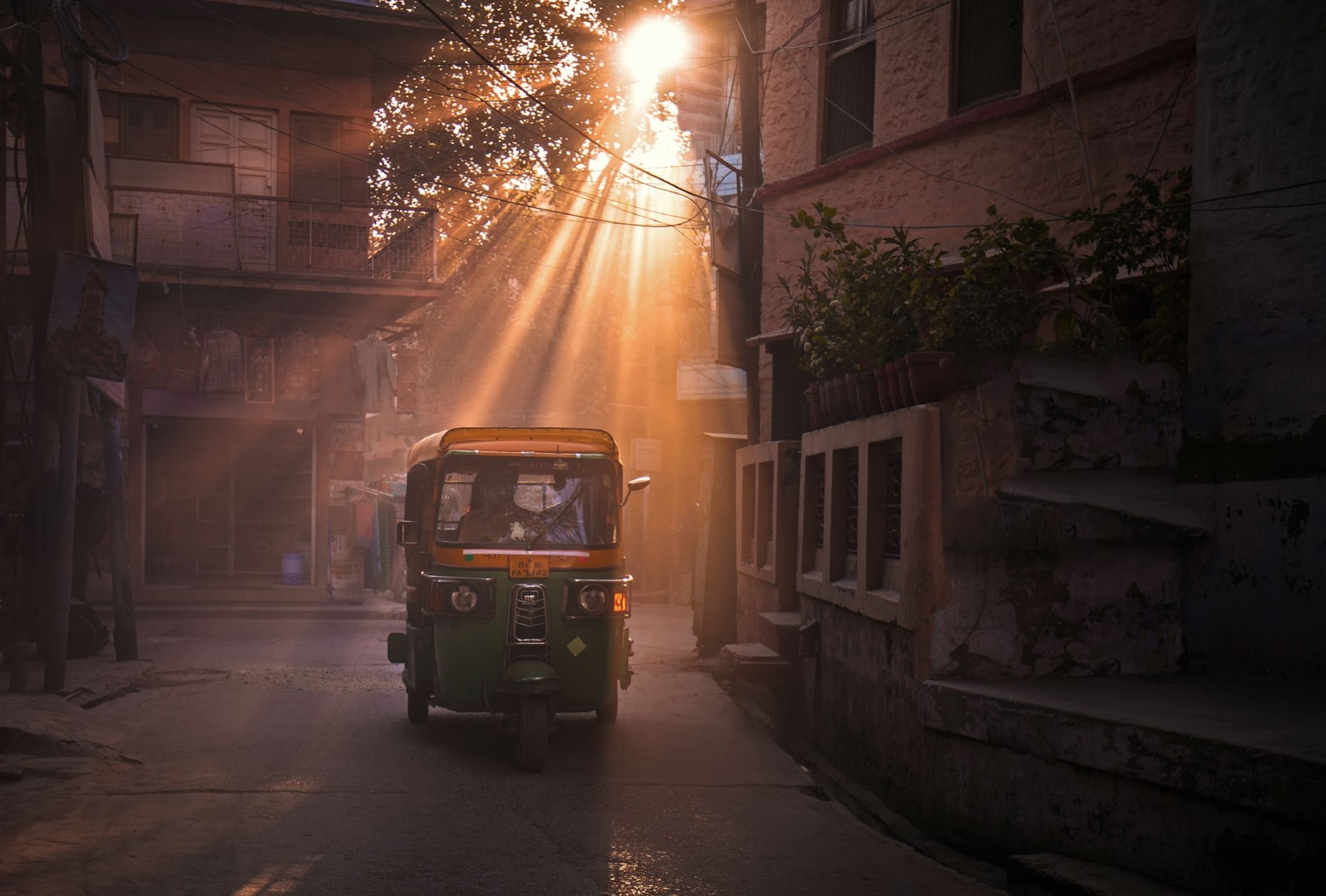a tuk tuk in sunlight in Jaipur, India