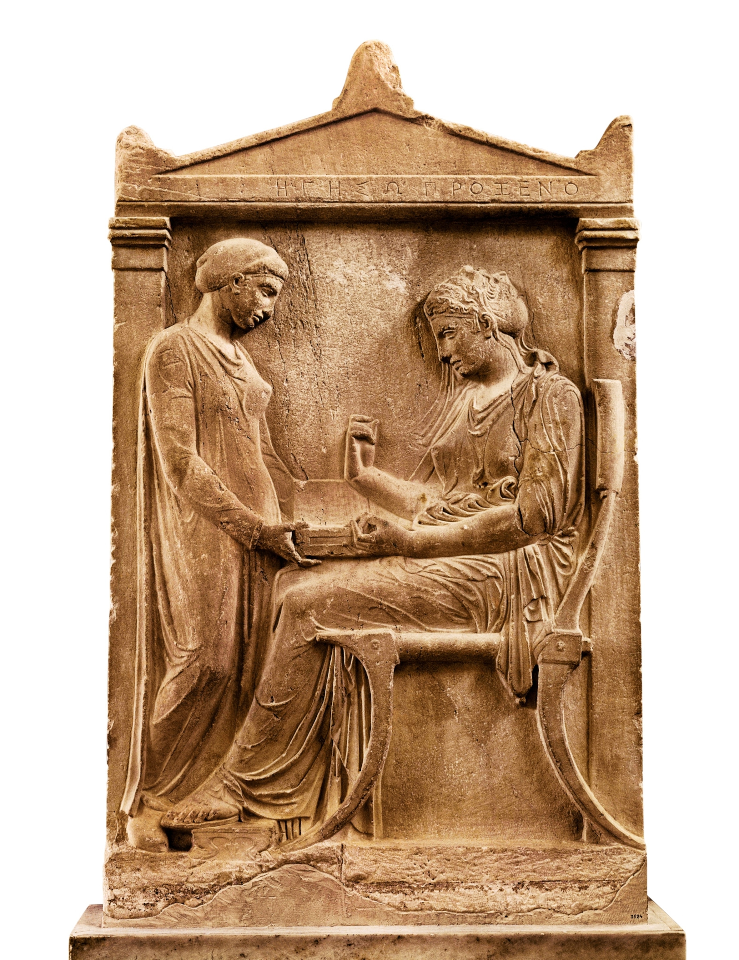 A stone relief of a seated woman with a box