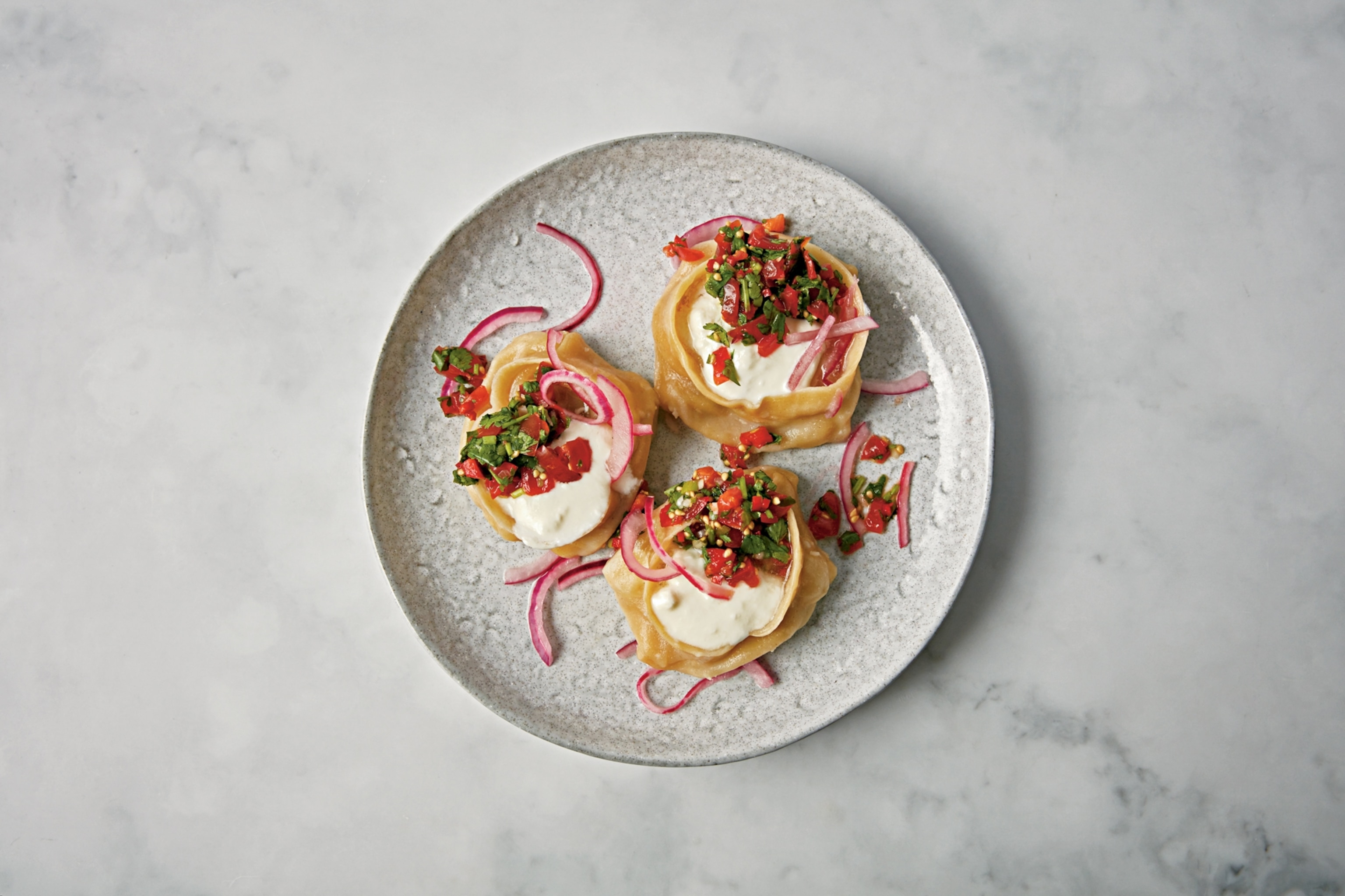 traditional manti dumplings served in a modern style