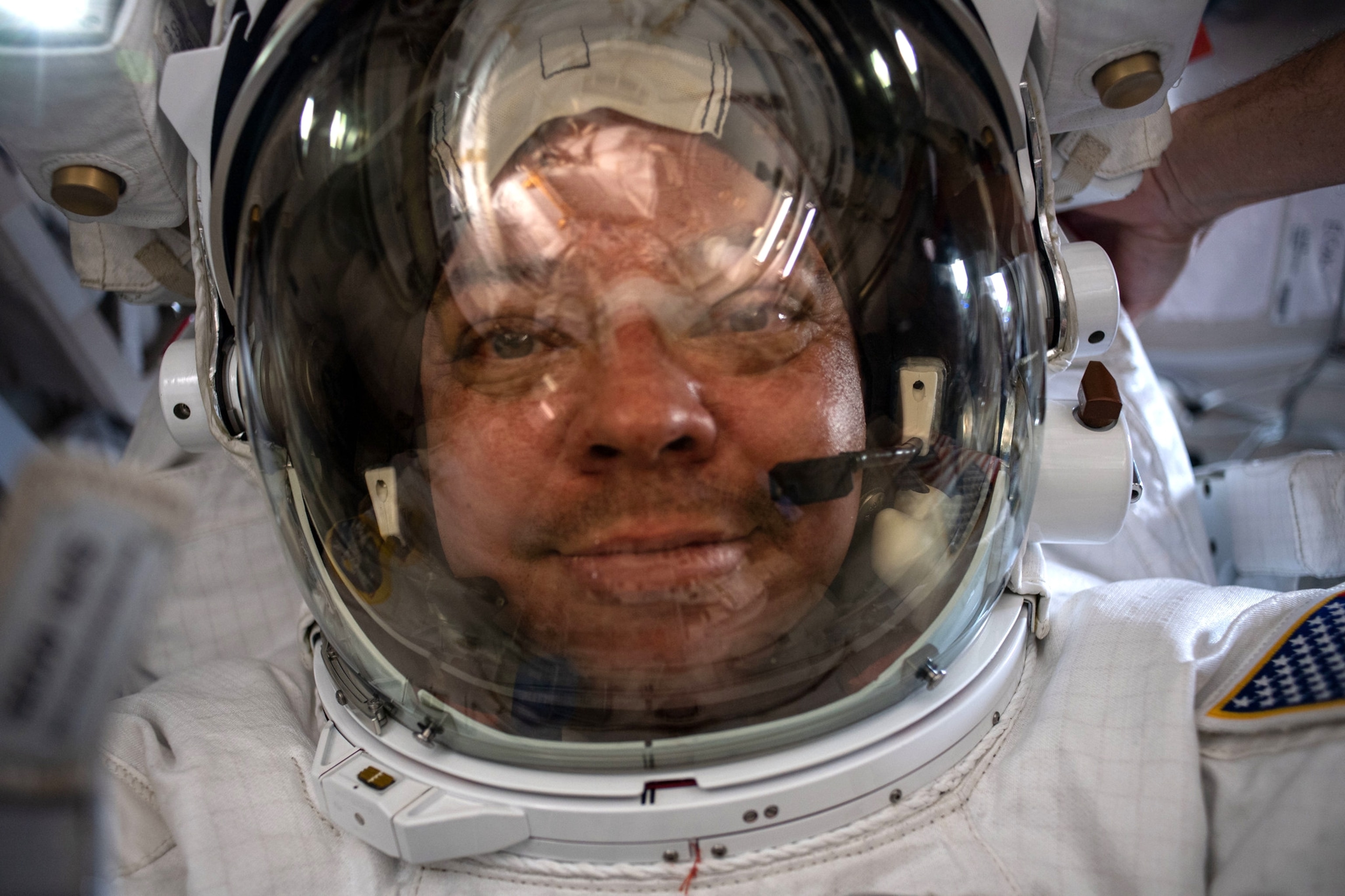 man's face through the glass visor.