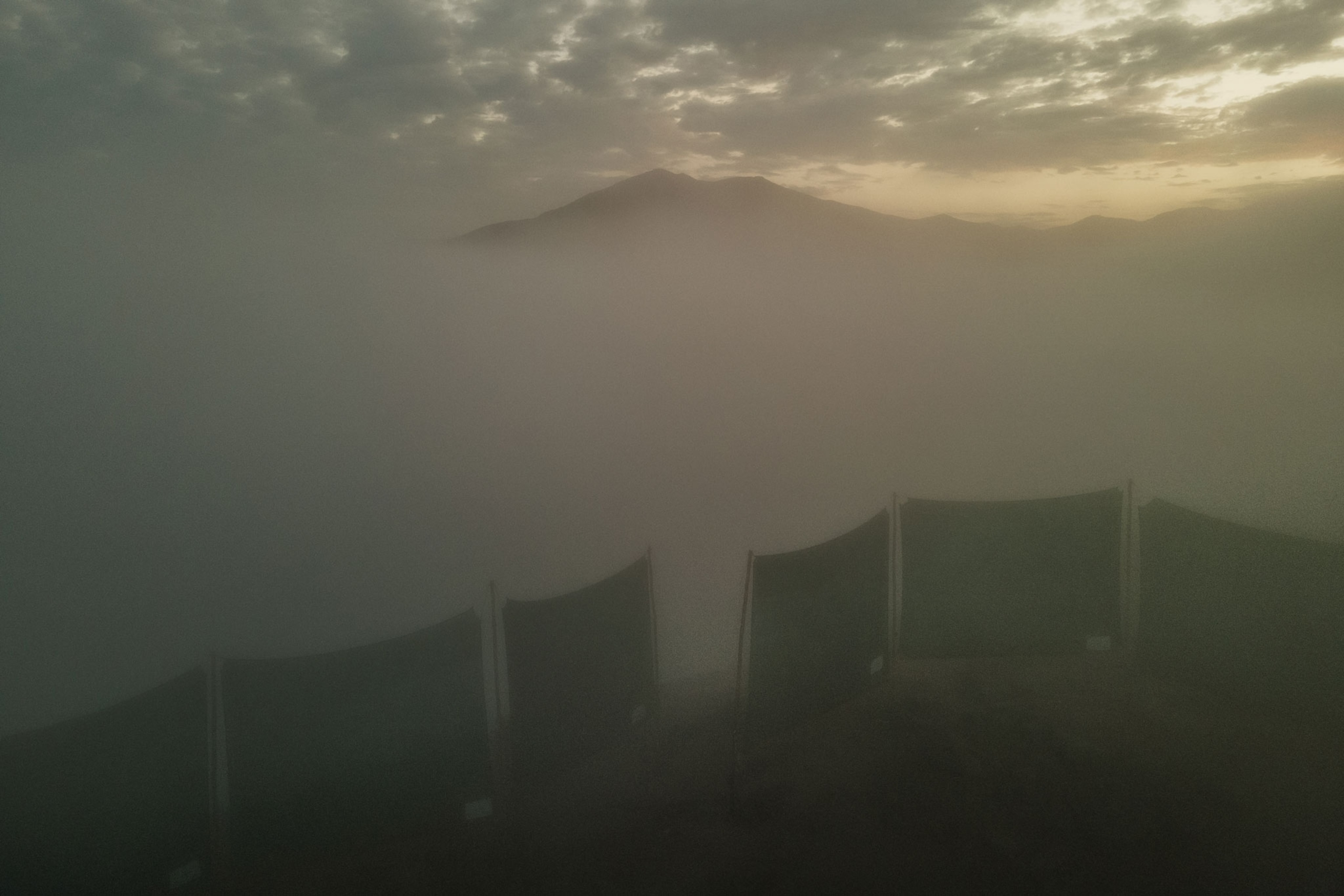 fog obstructs the view of a mountainous area