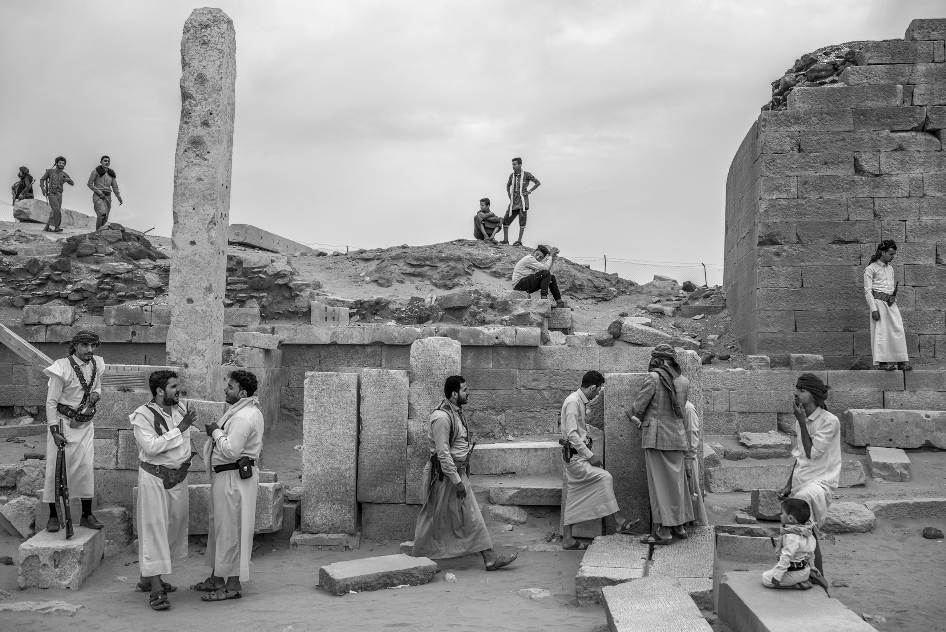 Picture of men at temple ruins.