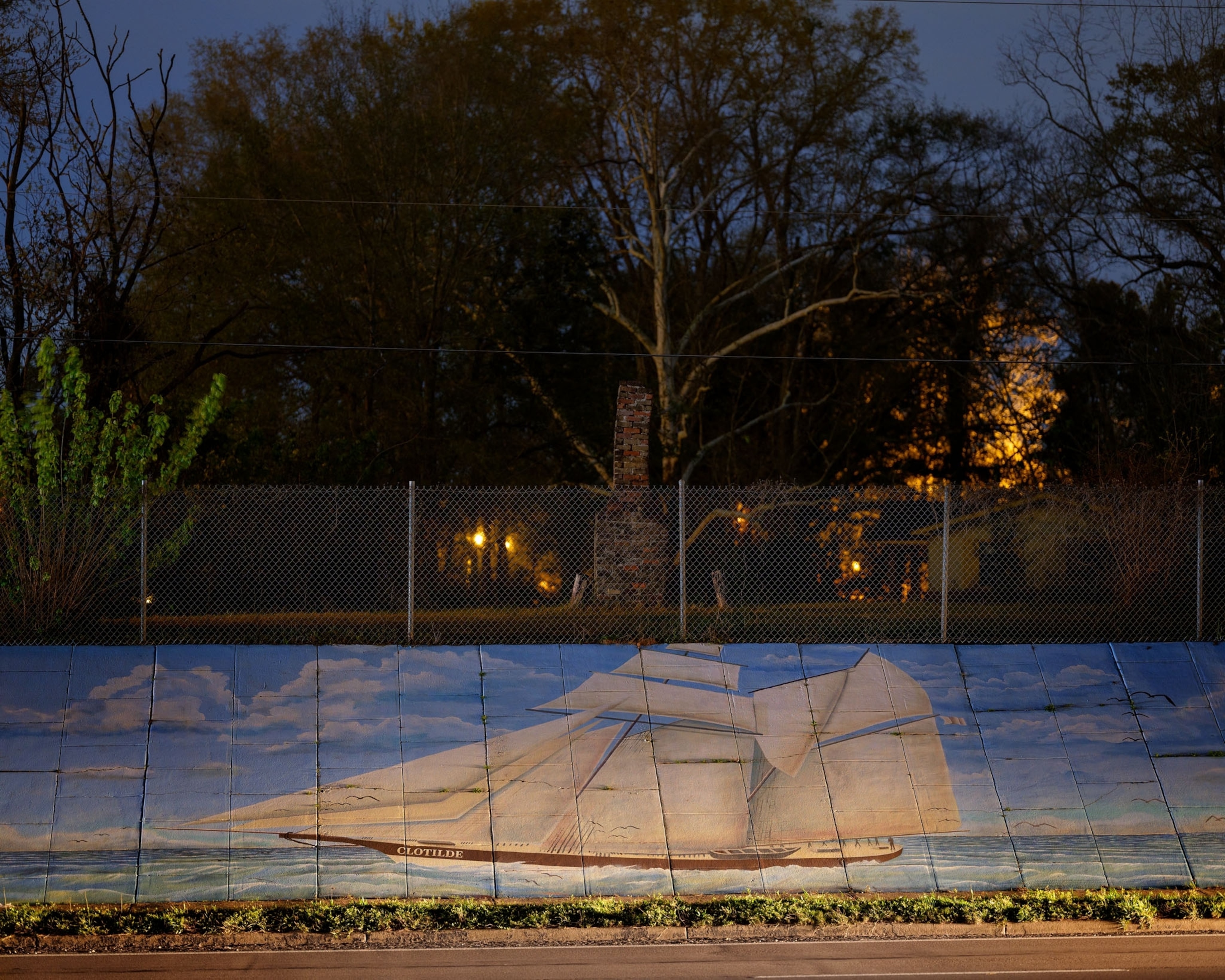 a painted mural of a ship at night