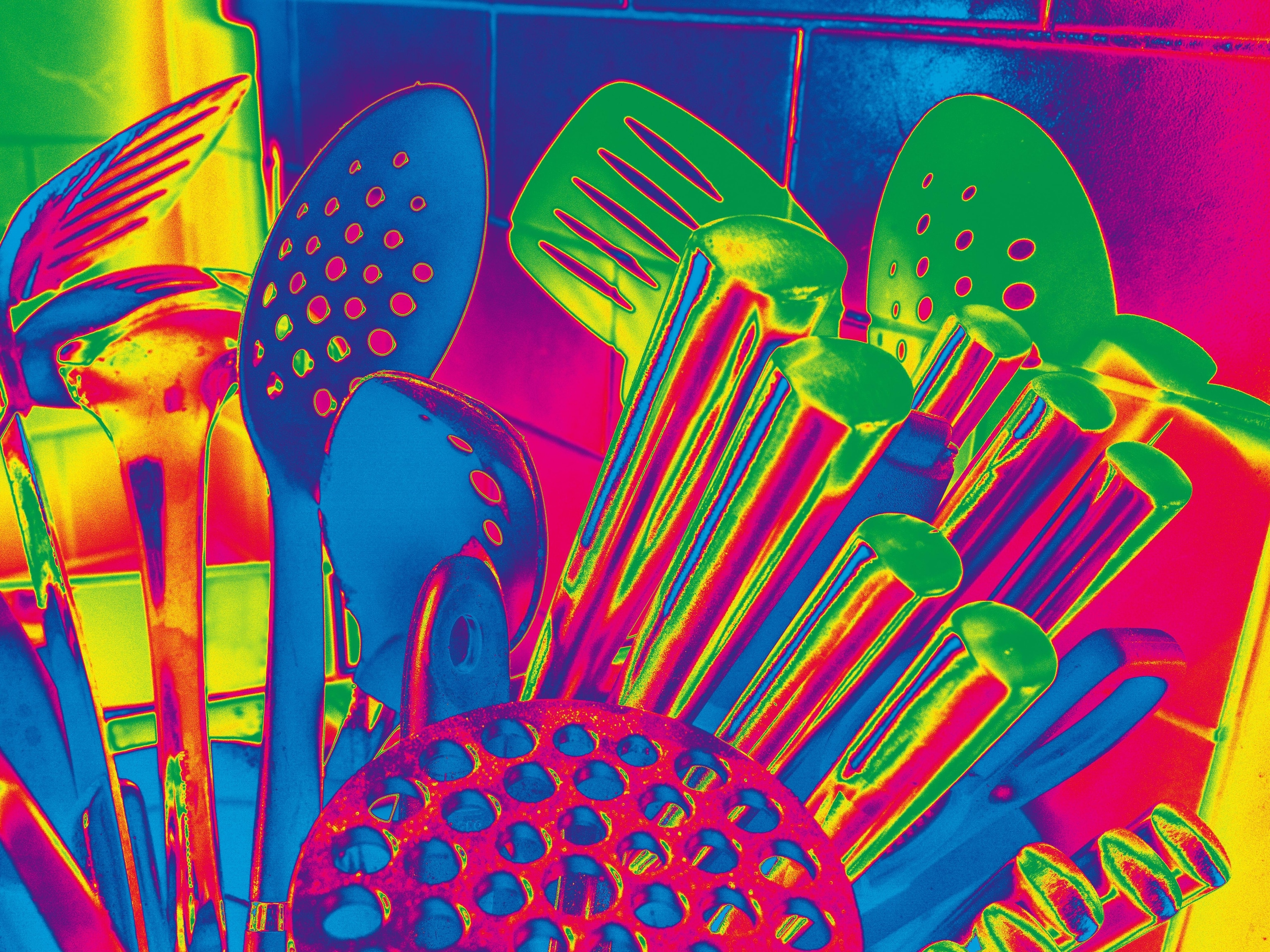 Close-up depiction of kitchen utensils in neon colors.