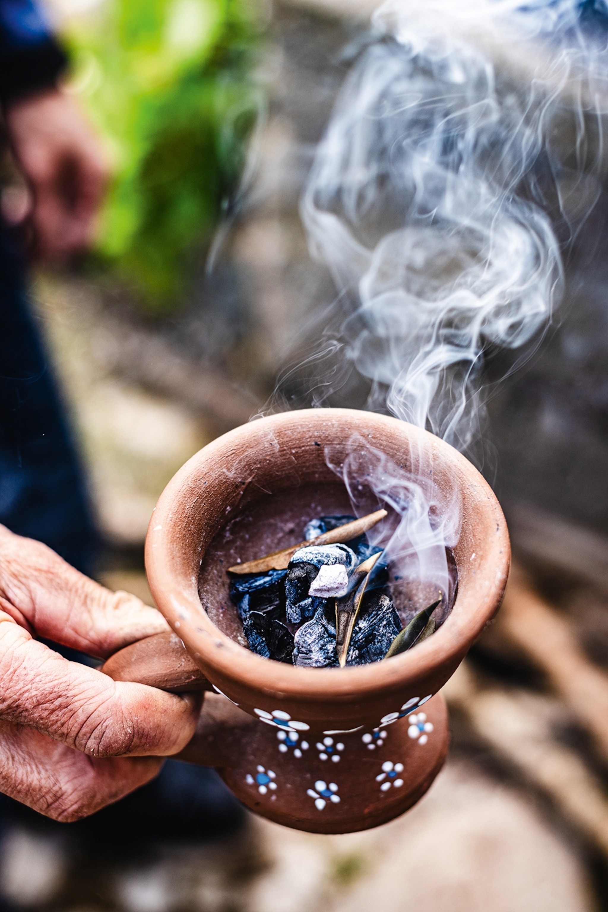 Incense burning in a ceramic mug