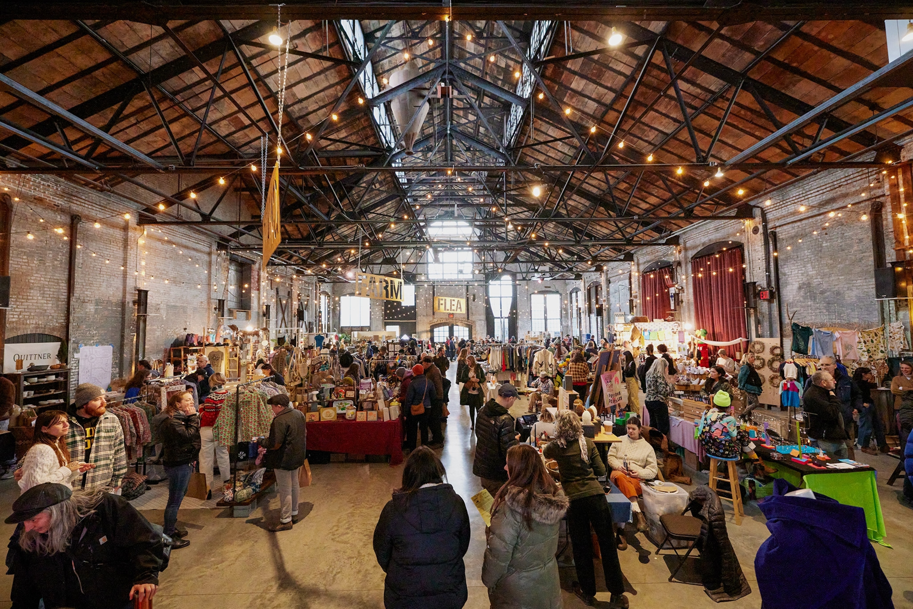 Shoppers congregate inside the Basilica Hudson