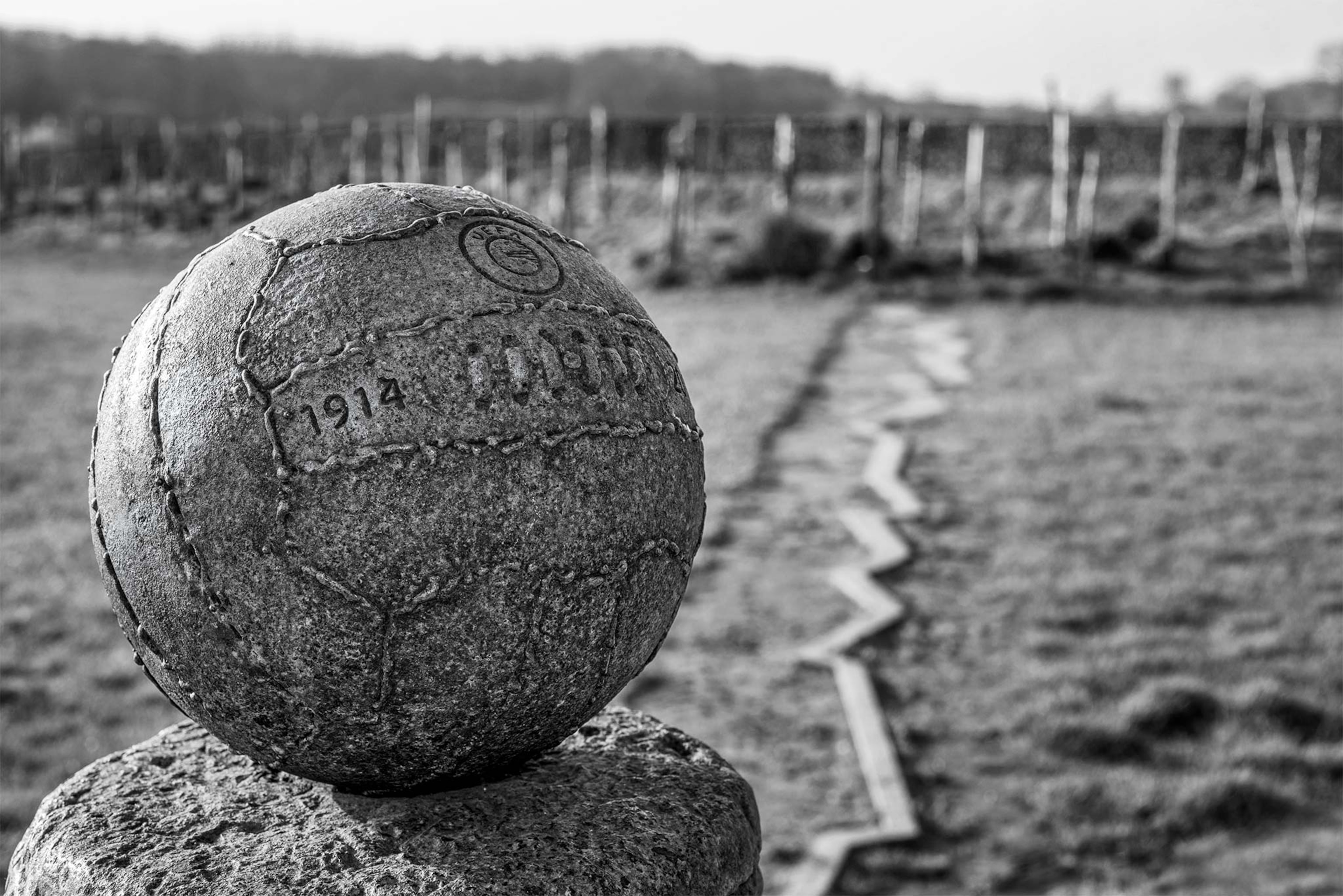 In Saint-Yvon, Belgium, a steel soccer ball atop an exploded shell was presented to honor the Christmas games.