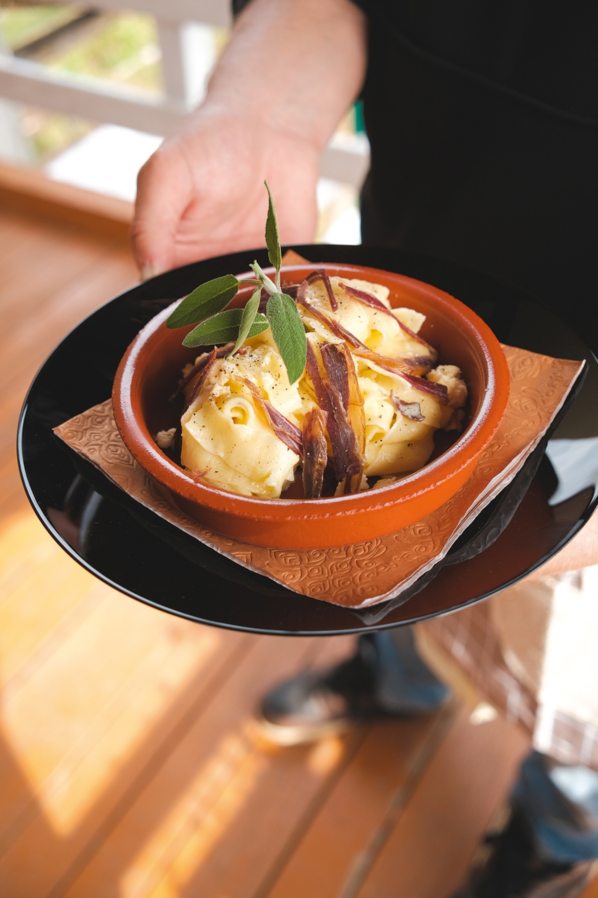 Food presented in a dish garnished with herbs
