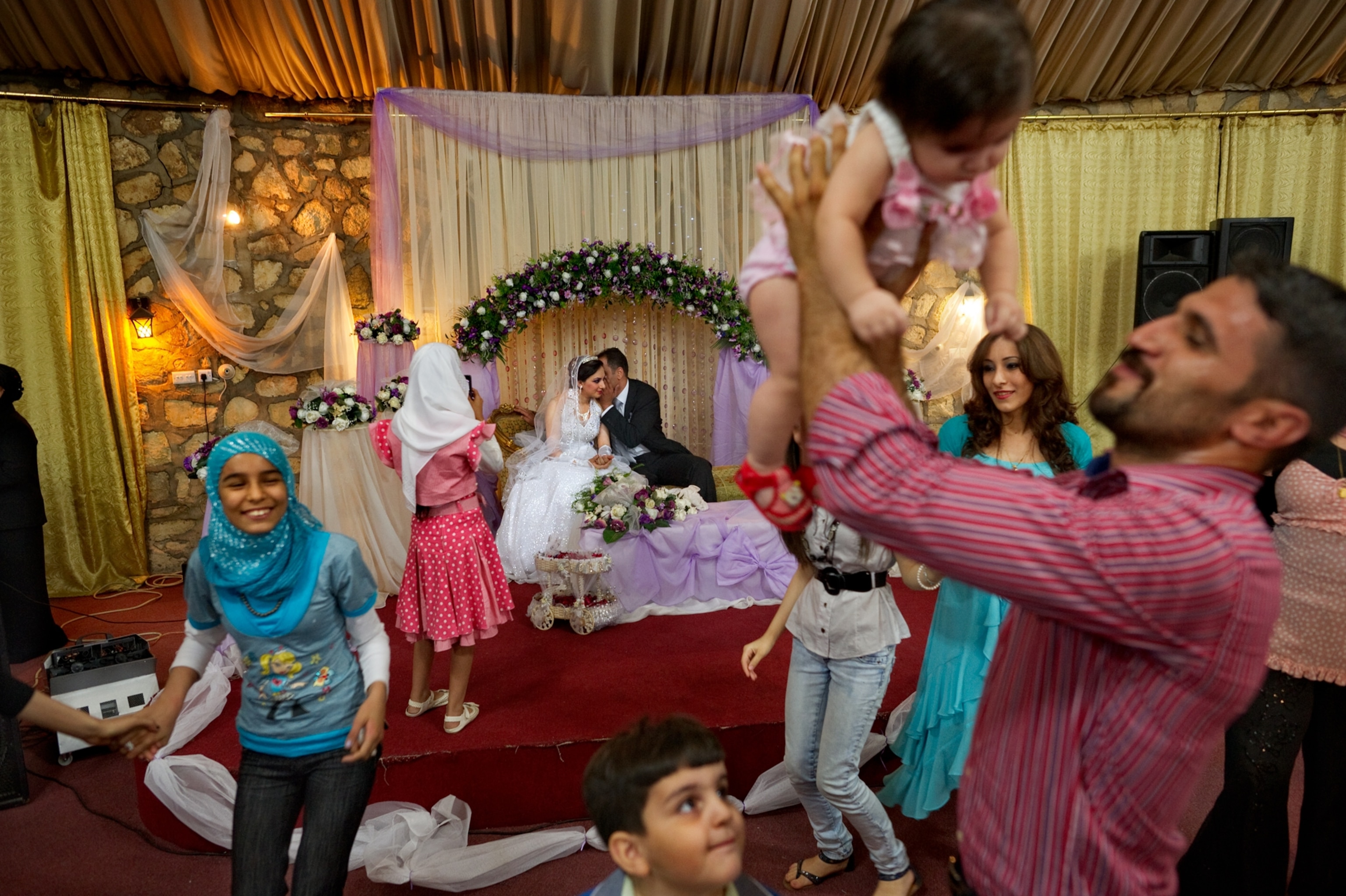 family and friends celebrating the wedding of a young couple