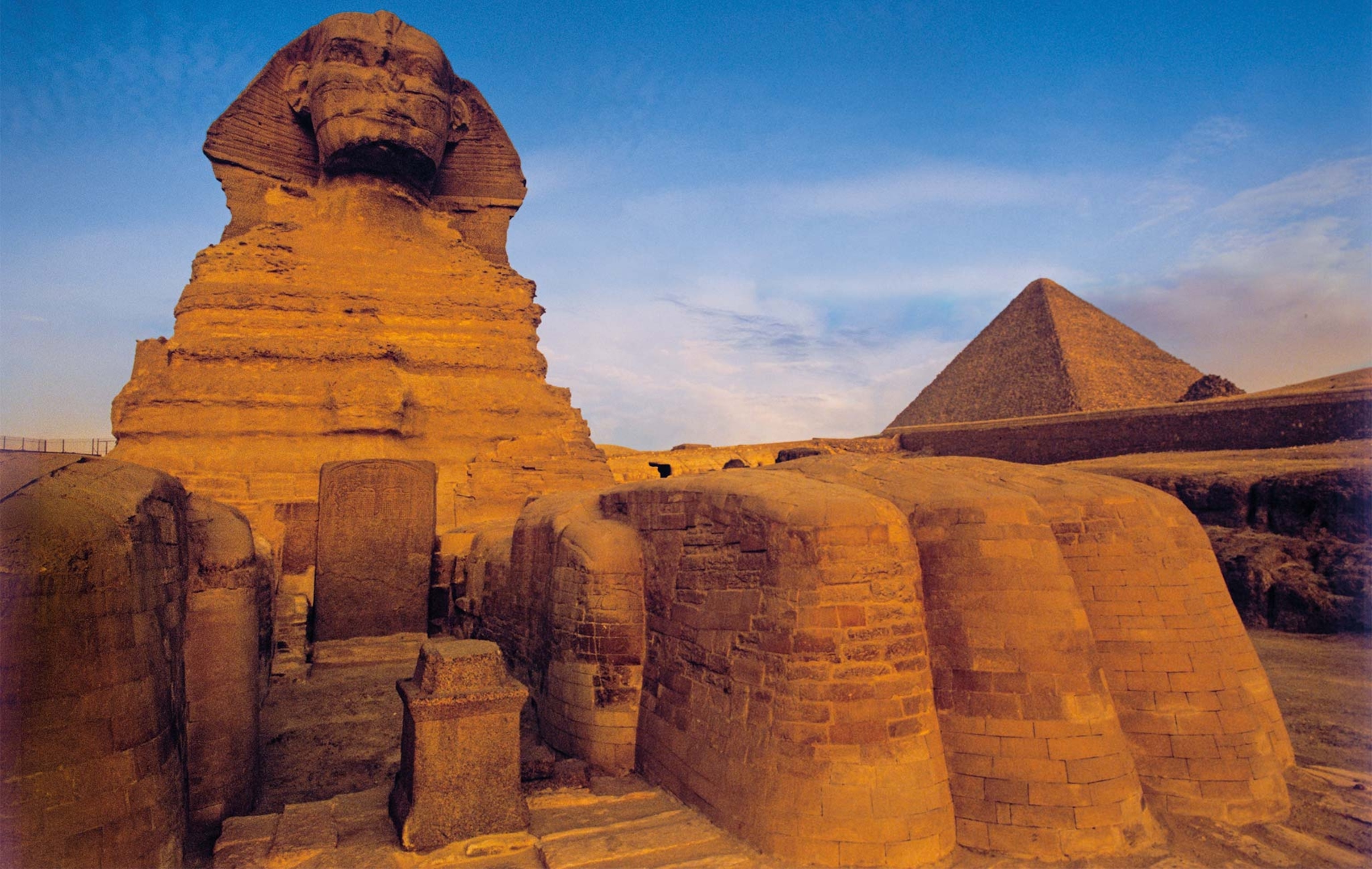 Built circa 2500 B.C. for the pharaoh Khafre, the Great Sphinx sits at the entrance to the Giza plateau. Behind it stands the Great Pyramid of Khufu, who was the father of Khafre.