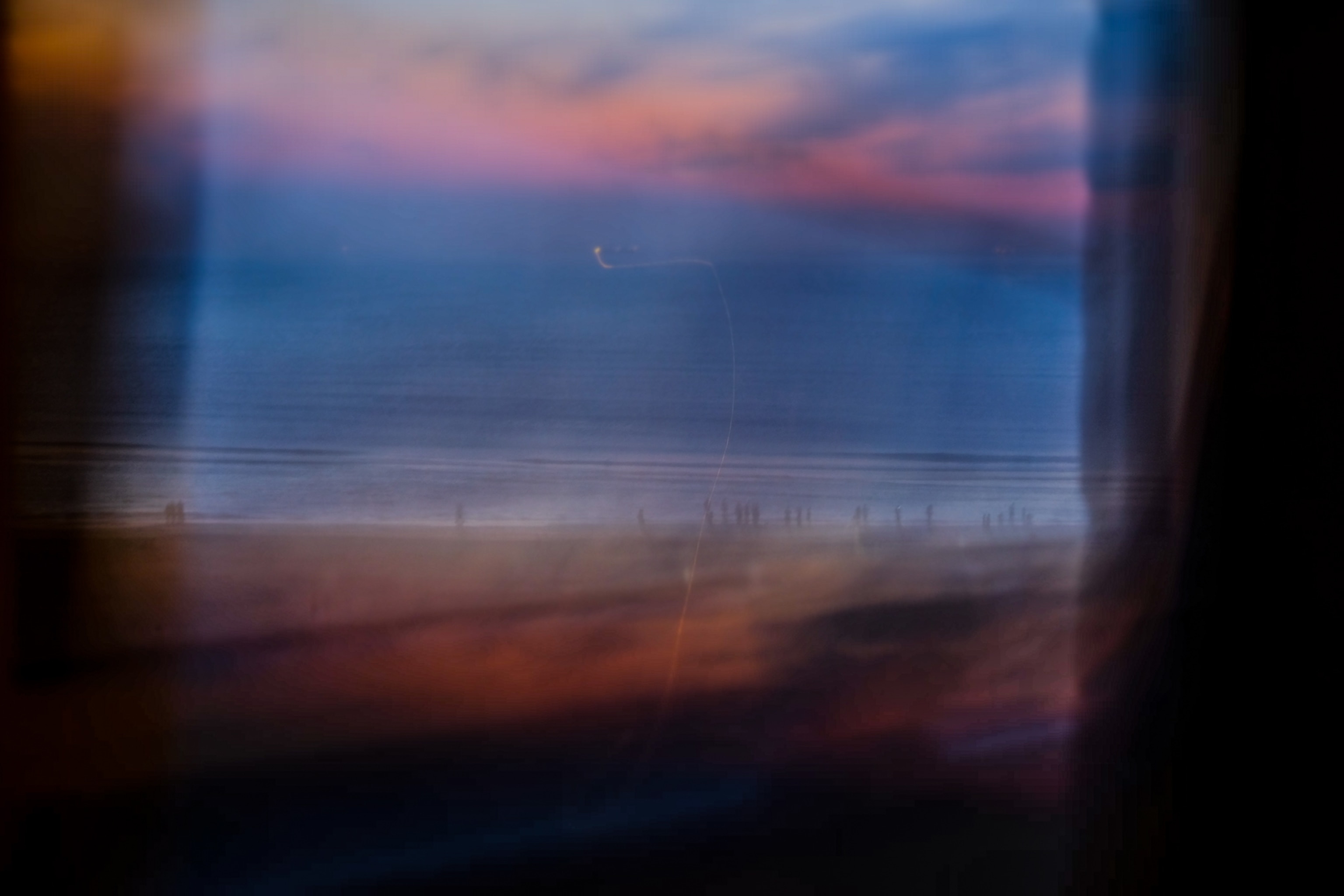 a sunset out of a reflective window