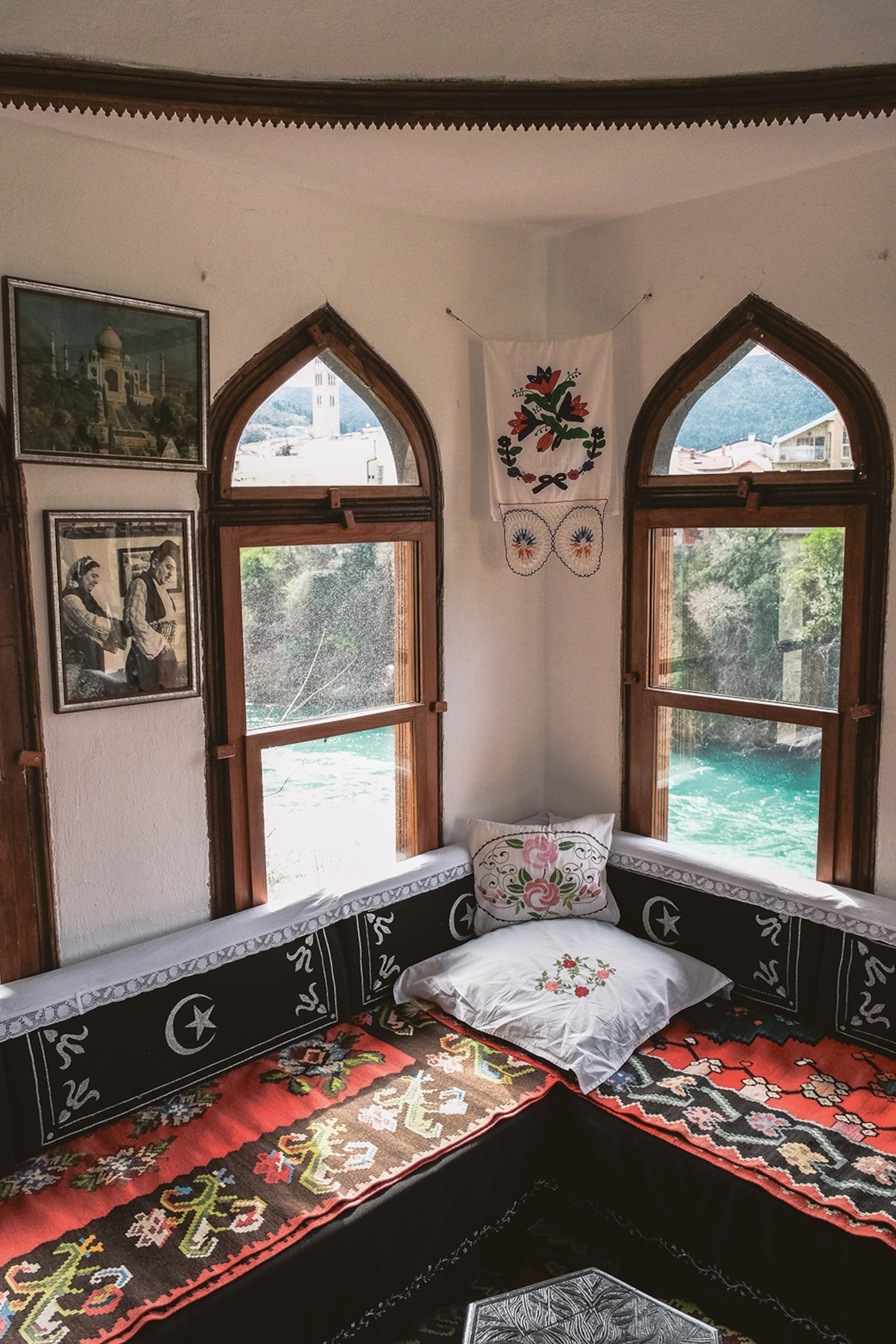 Patterned seat with windows looking out over a river