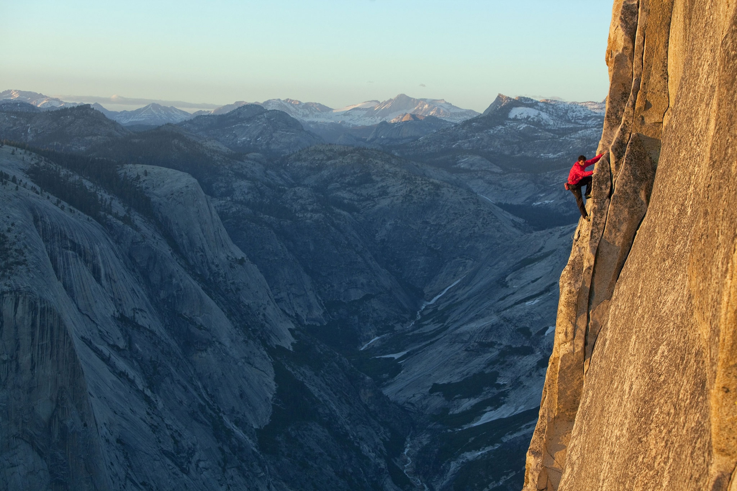 Alex Honnold climbing the side of a mountain
