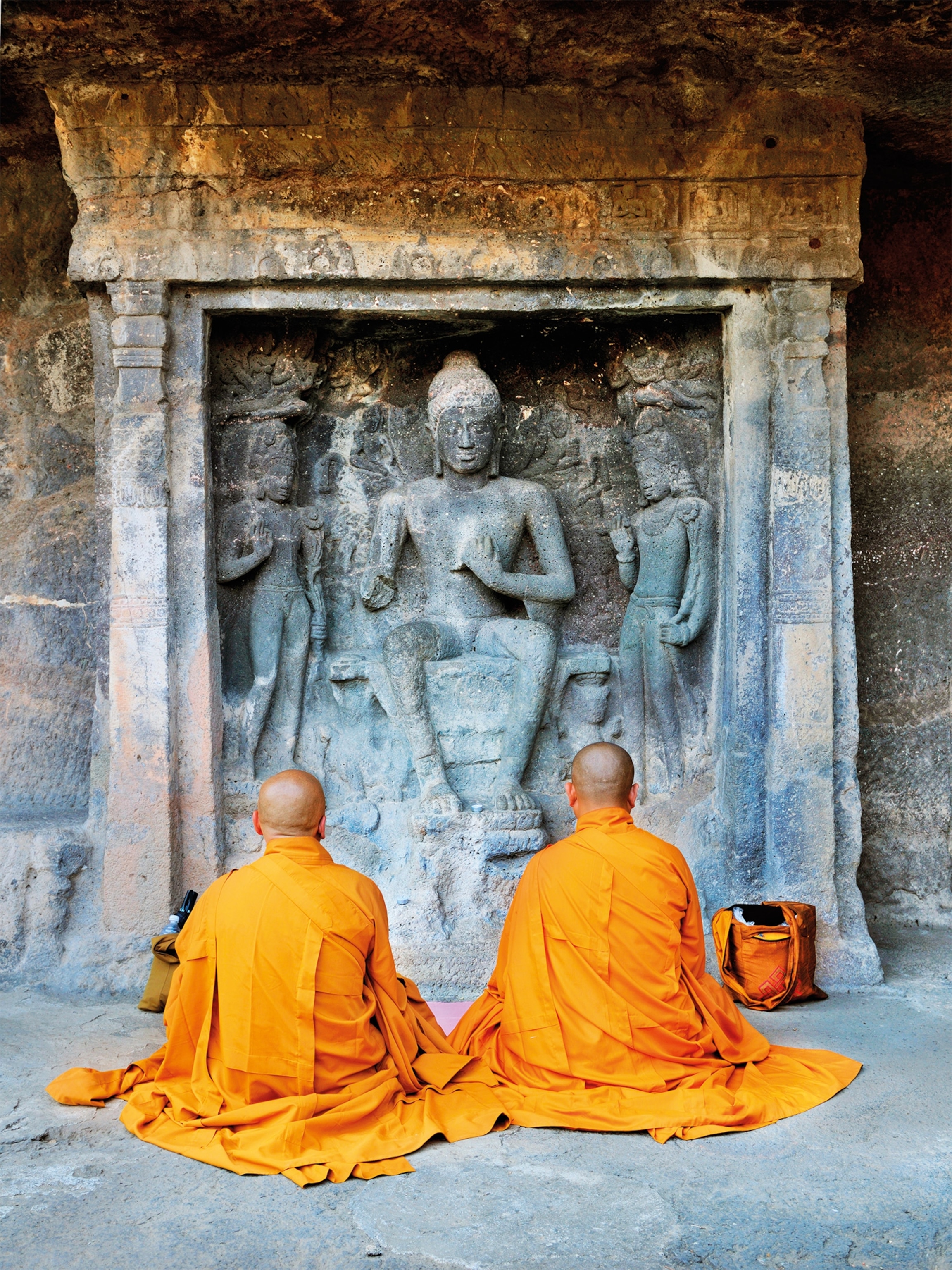 The caves’ visions of Buddha draw a wide variety of visitors, from tourists to Buddhist monks.