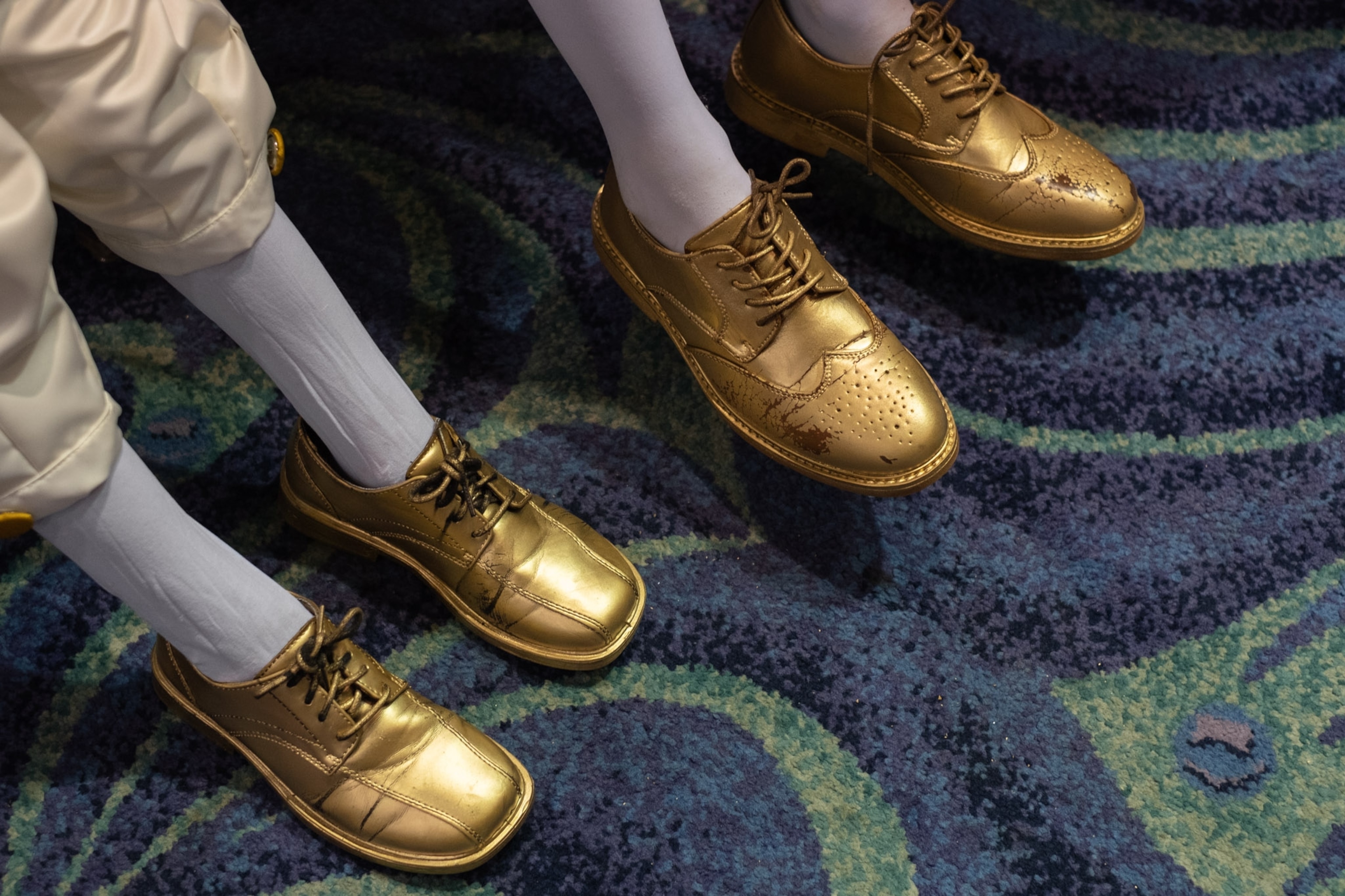 two sets of golden shoes