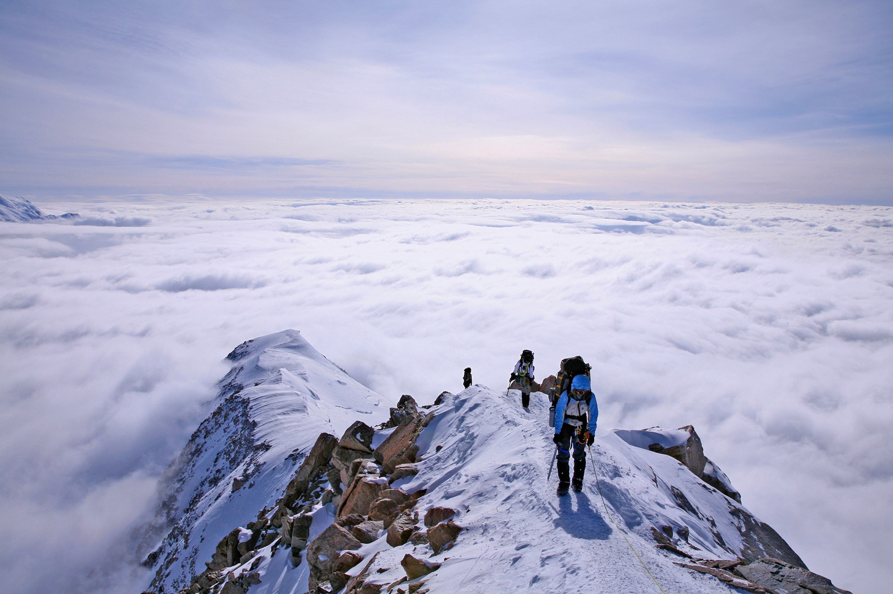 people climbing Mt. Denali in Alaska