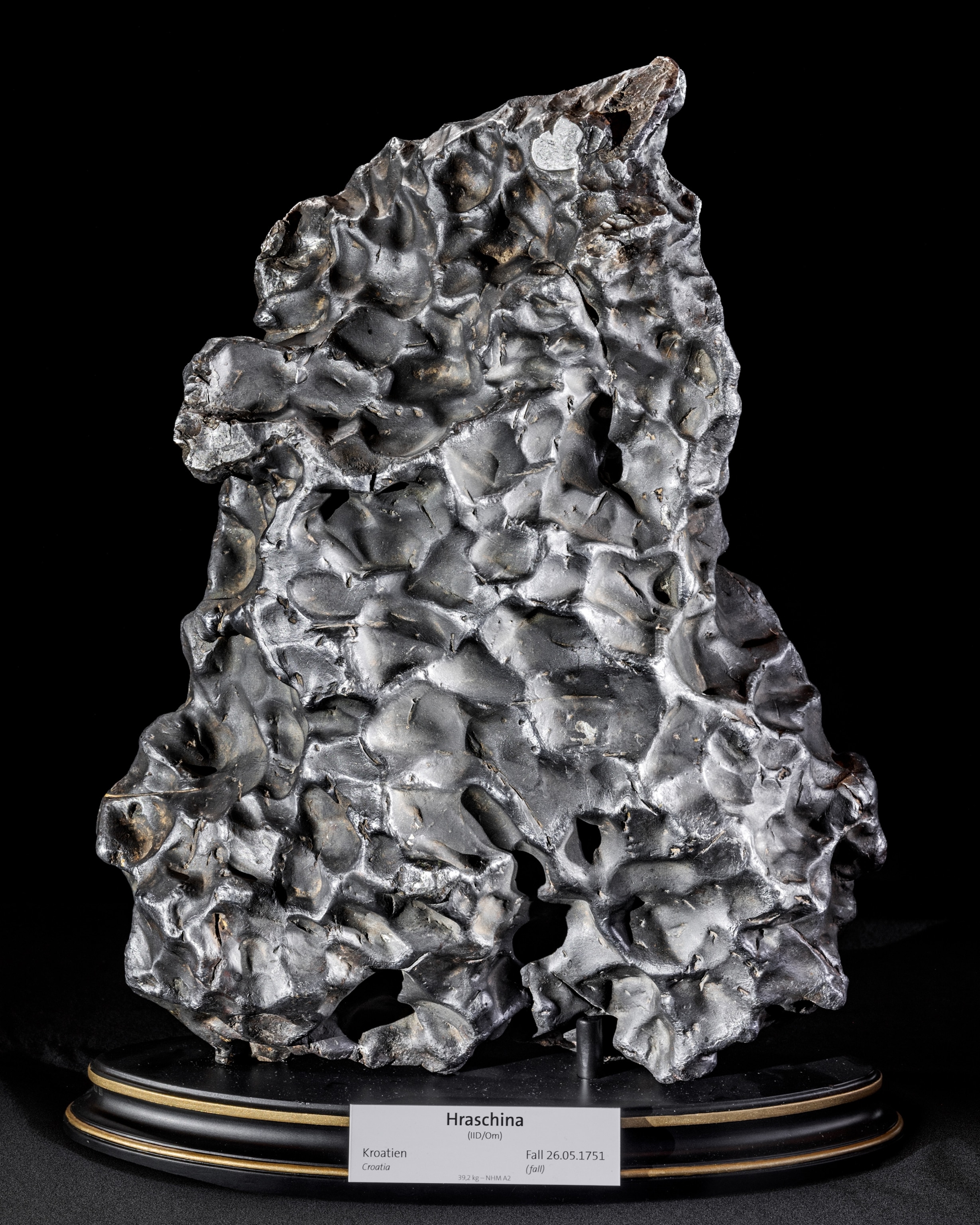 The metallic object of irregular shape on museum display.
