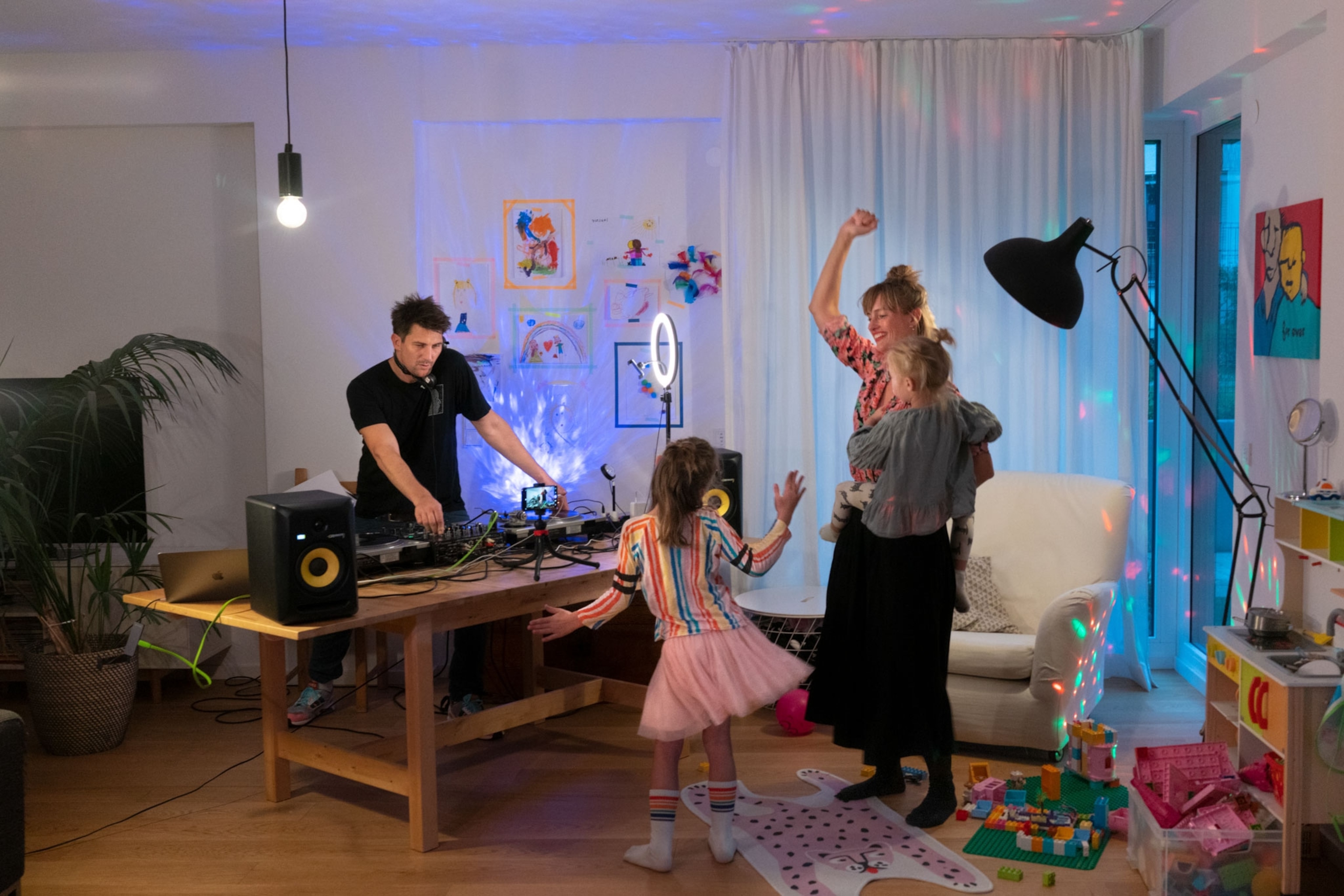 a family has a dance party in their home in Berlin, Germay